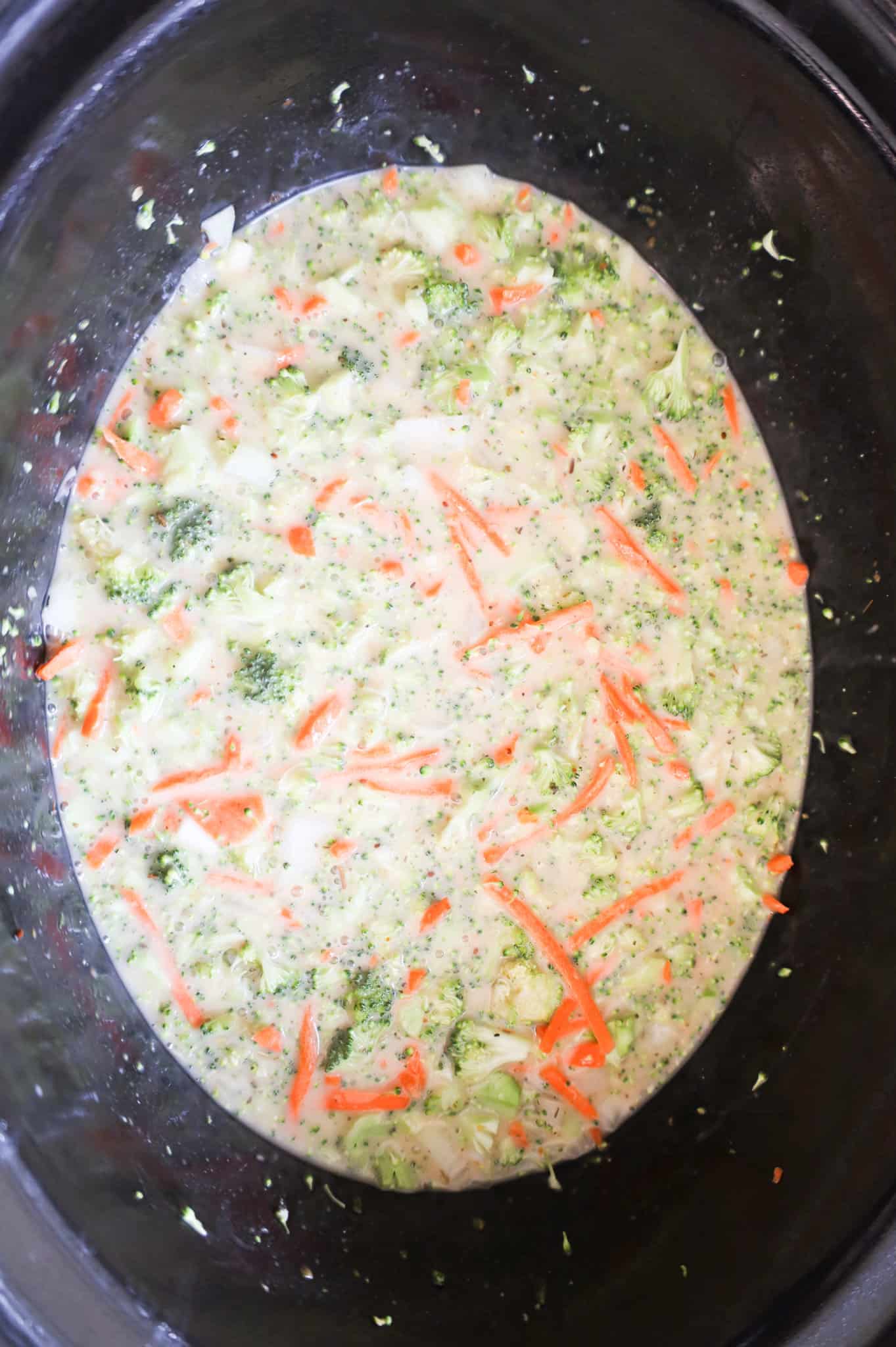 broccoli soup ingredients in a crock pot before cooking