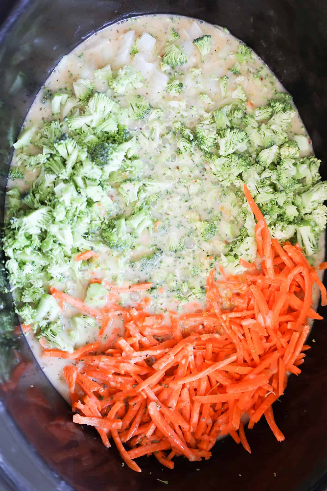 broccoli florets, matchstick carrots and soup mixture in a crock pot