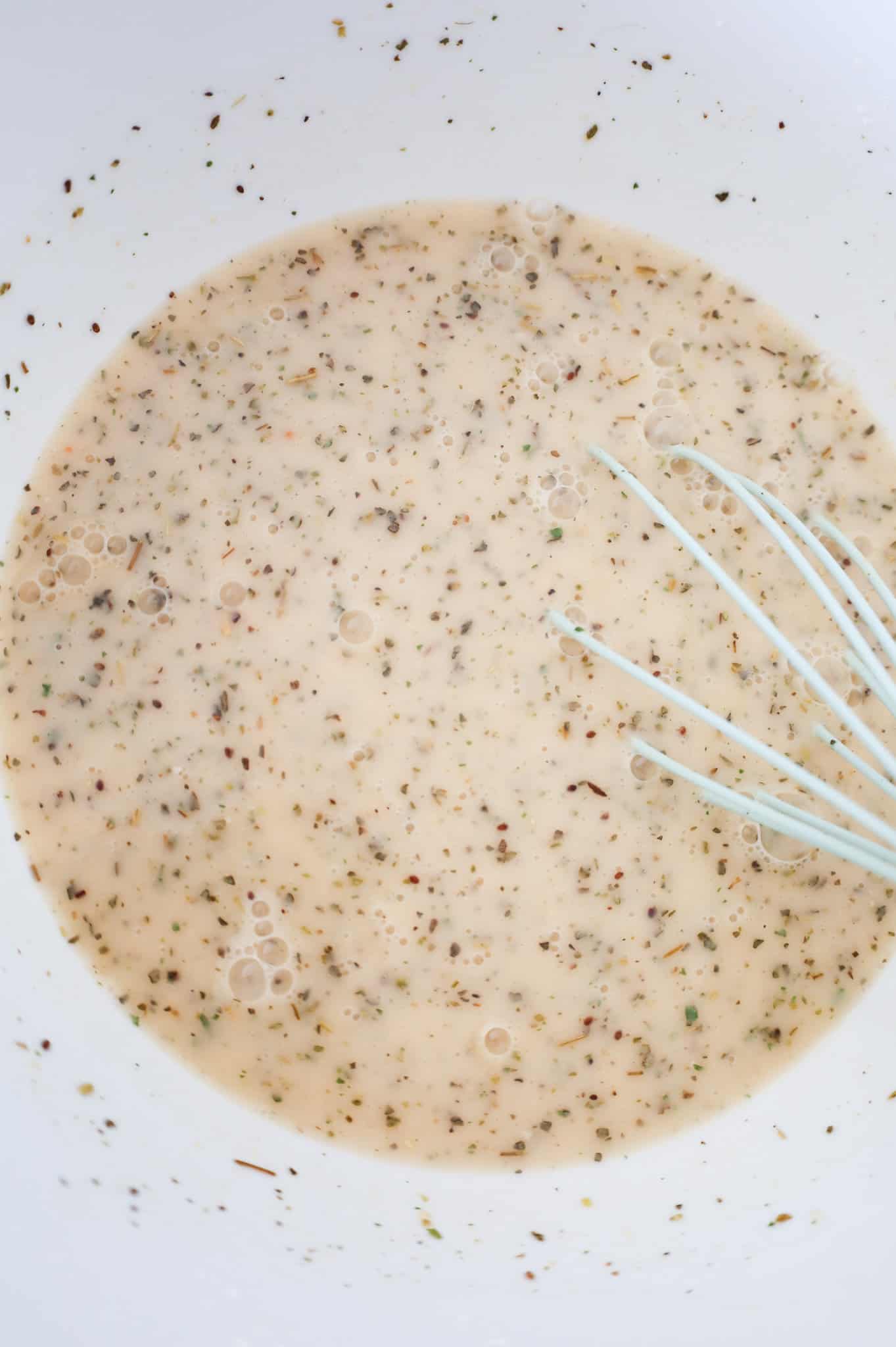 cornstarch, spices, cheddar soup and chicken broth whisked together in a bowl