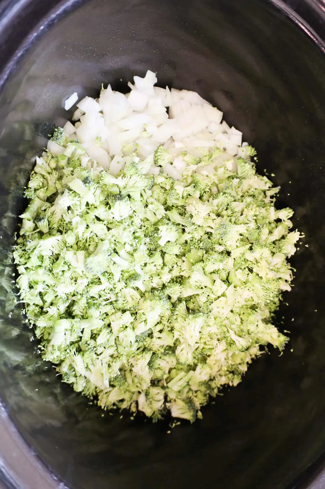 chopped broccoli florets and diced onions in a crock pot