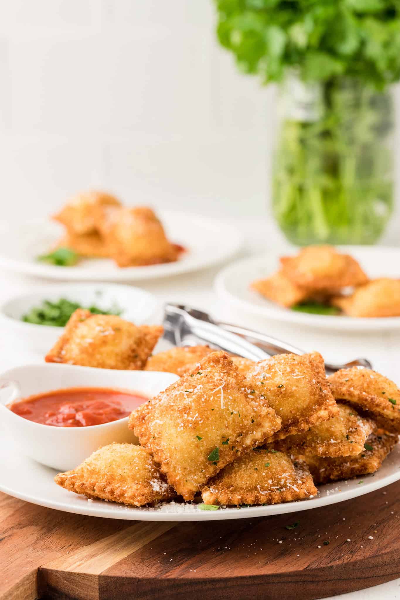 Fried Ravioli are a delicious appetizer made with store bought ravioli coated in an Italian breadcrumb and Parmesan cheese mixture and fried until golden brown and crispy.