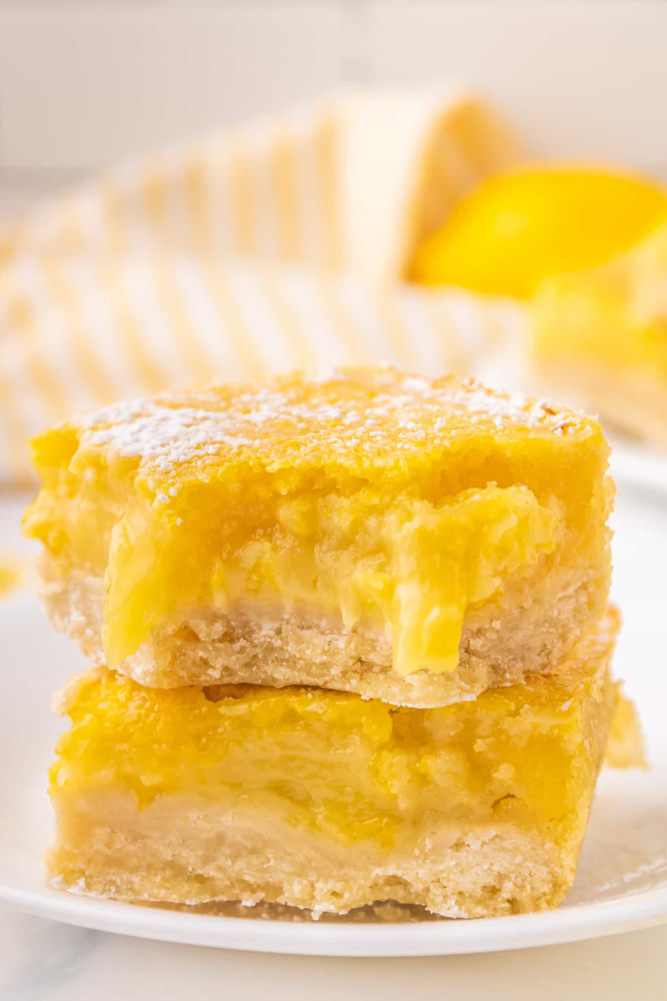 Lemon Bars are a decadent dessert with a shortbread like base topped with a smooth, rich lemon layer.