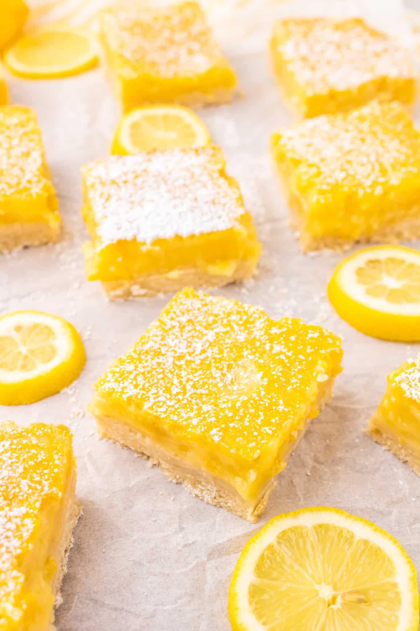 Lemon Bars are a decadent dessert with a shortbread like base topped with a smooth, rich lemon layer.