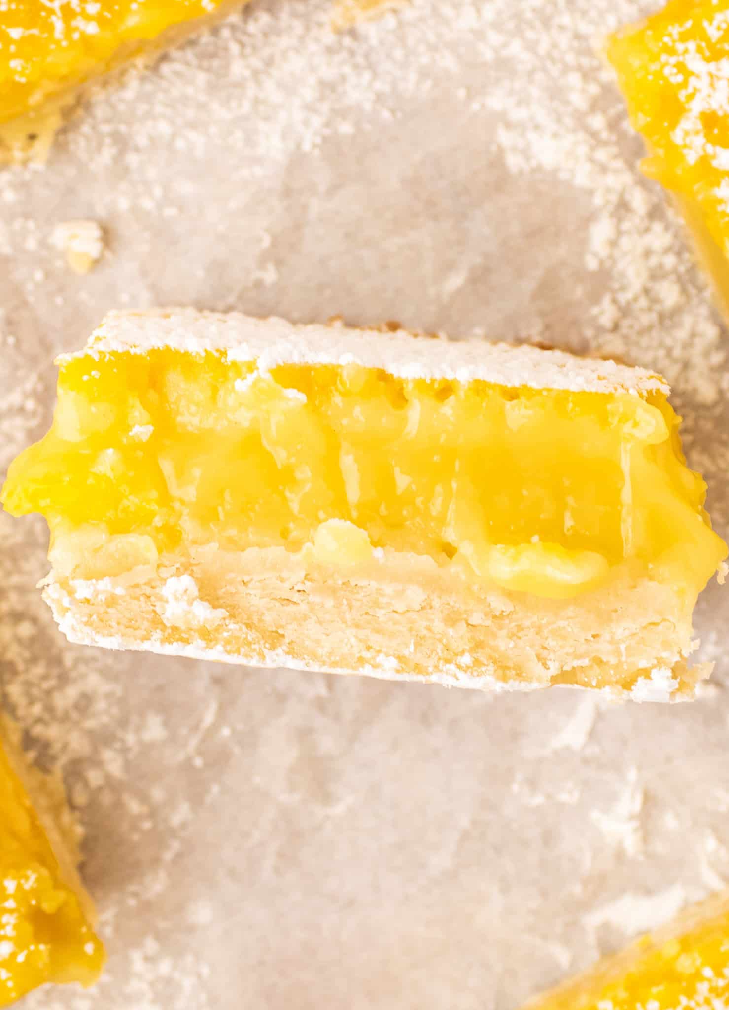 Lemon Bars are a decadent dessert with a shortbread like base topped with a smooth, rich lemon layer.