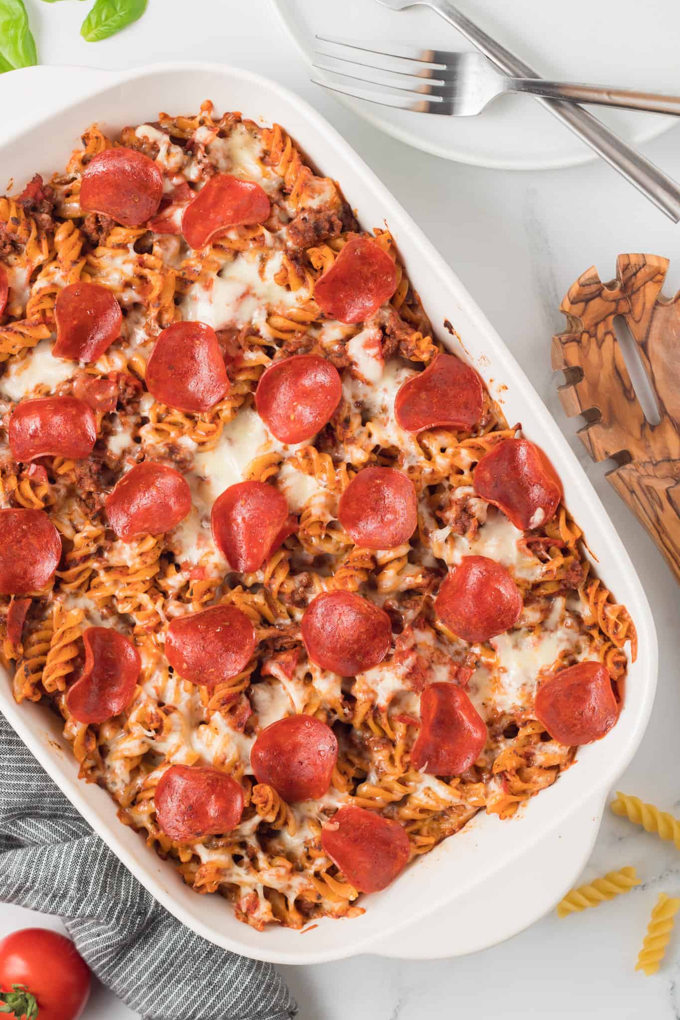 Pizza Casserole is a delicious baked rotini pasta loaded with ground beef, pizza sauce, pepperoni and mozzarella cheese.