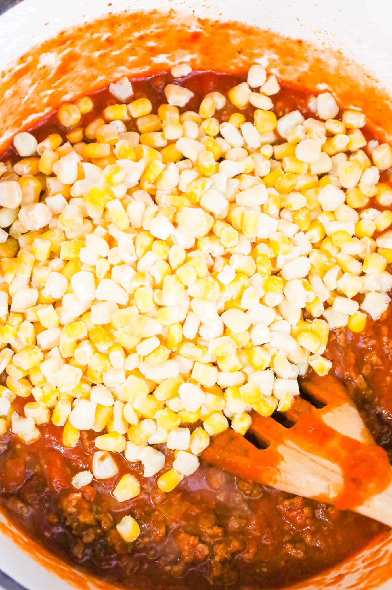 frozen corn added to pot with salsa and ground beef mixture