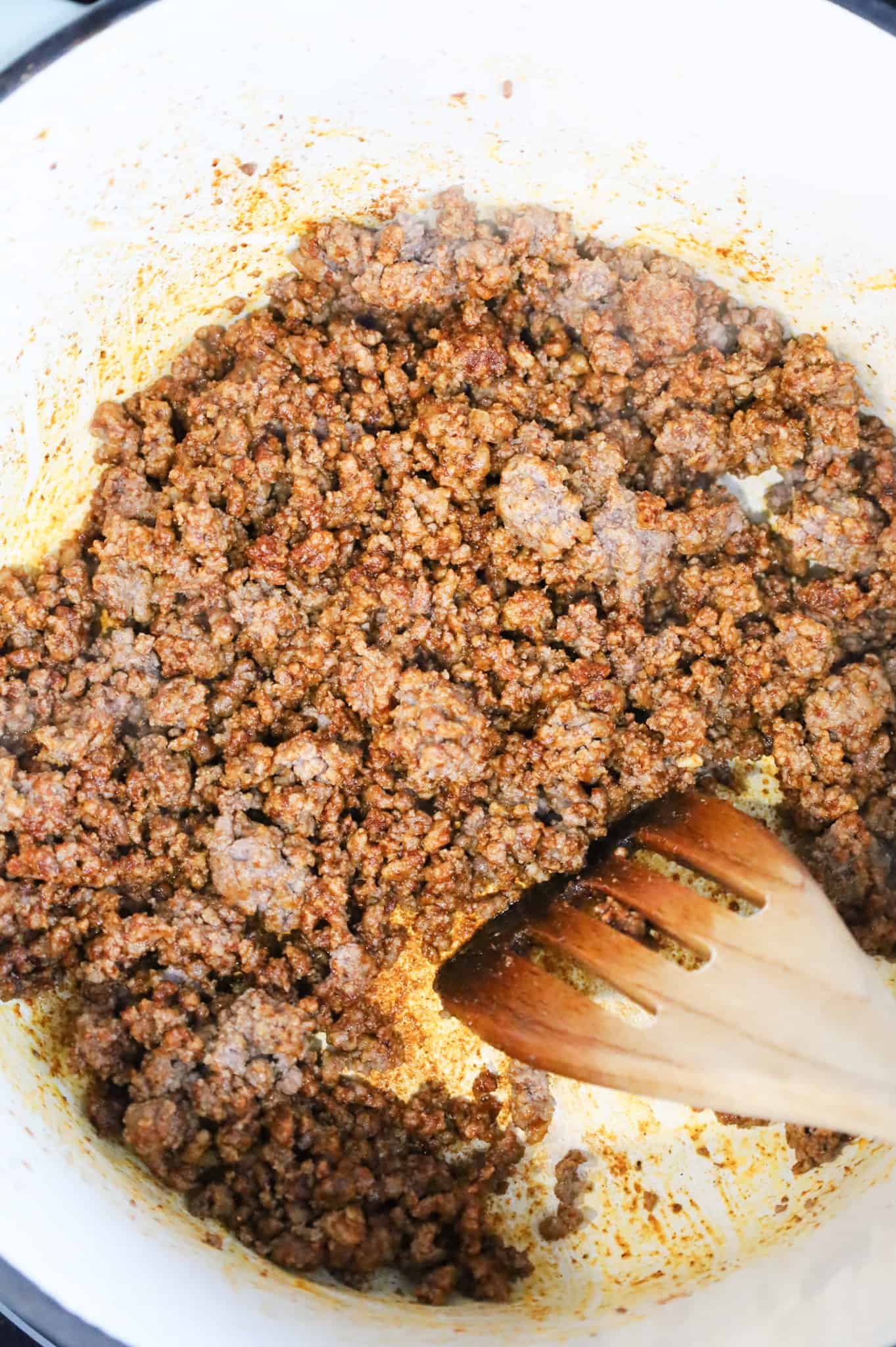 ground beef coated in taco seasoning in a pot