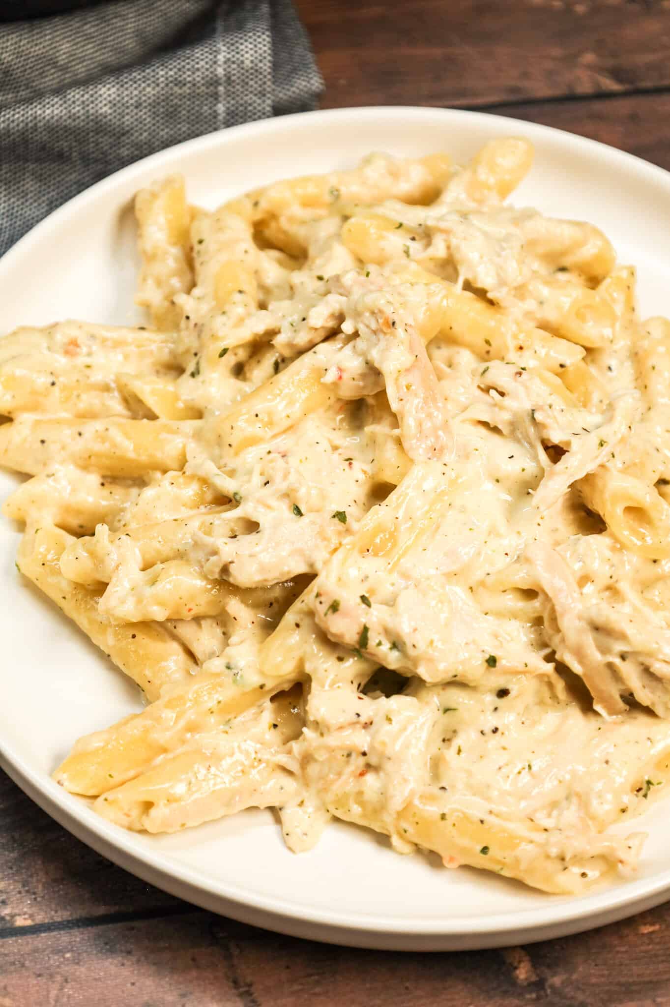 Chicken Alfredo Penne is an easy stove top pasta recipe loaded with shredded rotisserie chicken all tossed in a creamy garlic parmesan sauce.