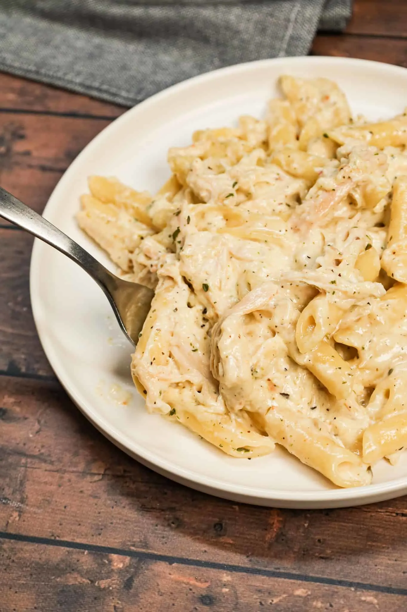 Chicken Alfredo Penne is an easy stove top pasta recipe loaded with shredded rotisserie chicken all tossed in a creamy garlic parmesan sauce.
