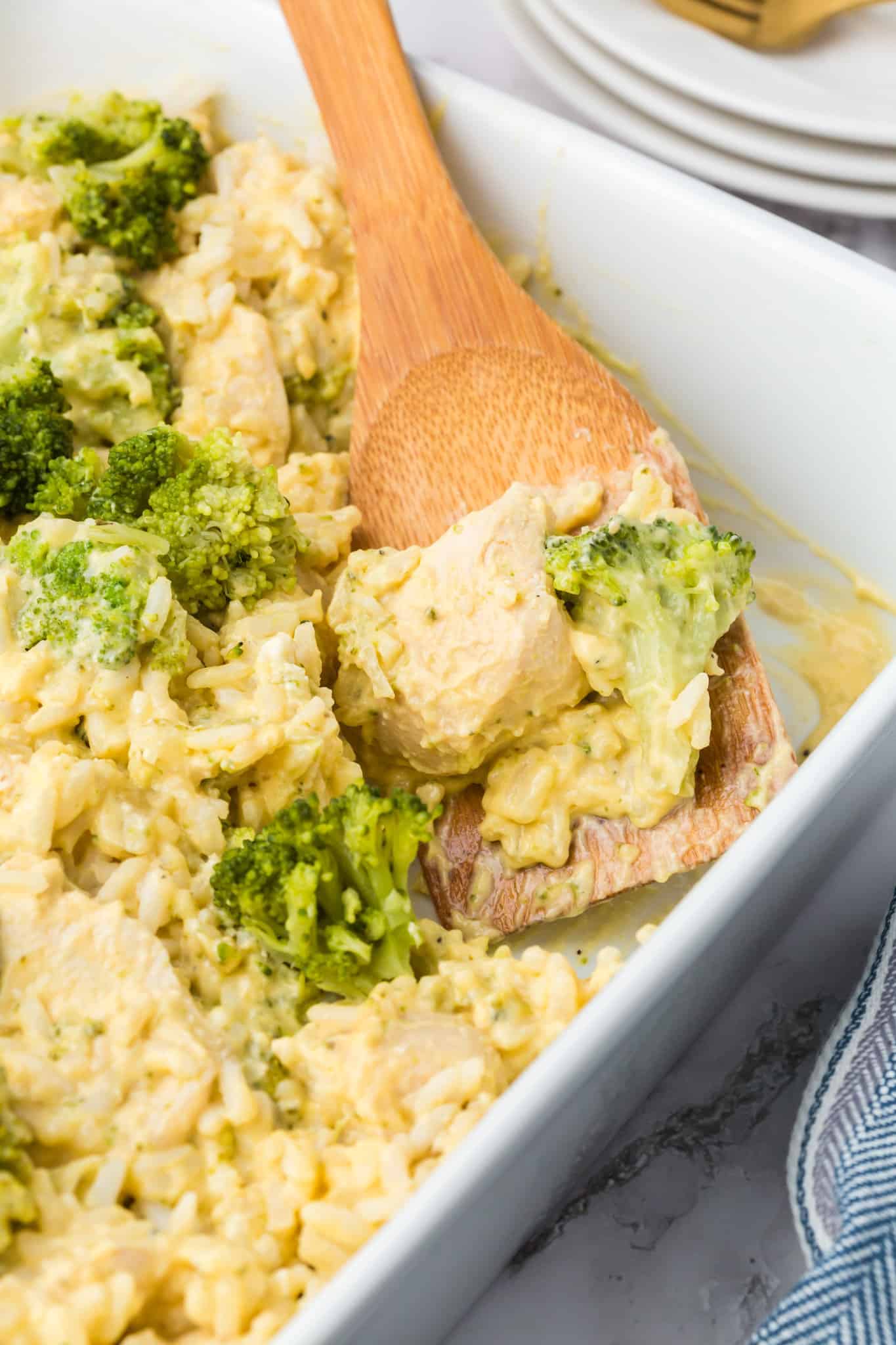 Chicken Broccoli Rice Casserole is an easy chicken dinner recipe made with chicken breasts, cream of broccoli soup, broccoli florets, white rice, cream cheese, sour cream Velveeta and shredded Colby jack cheese.