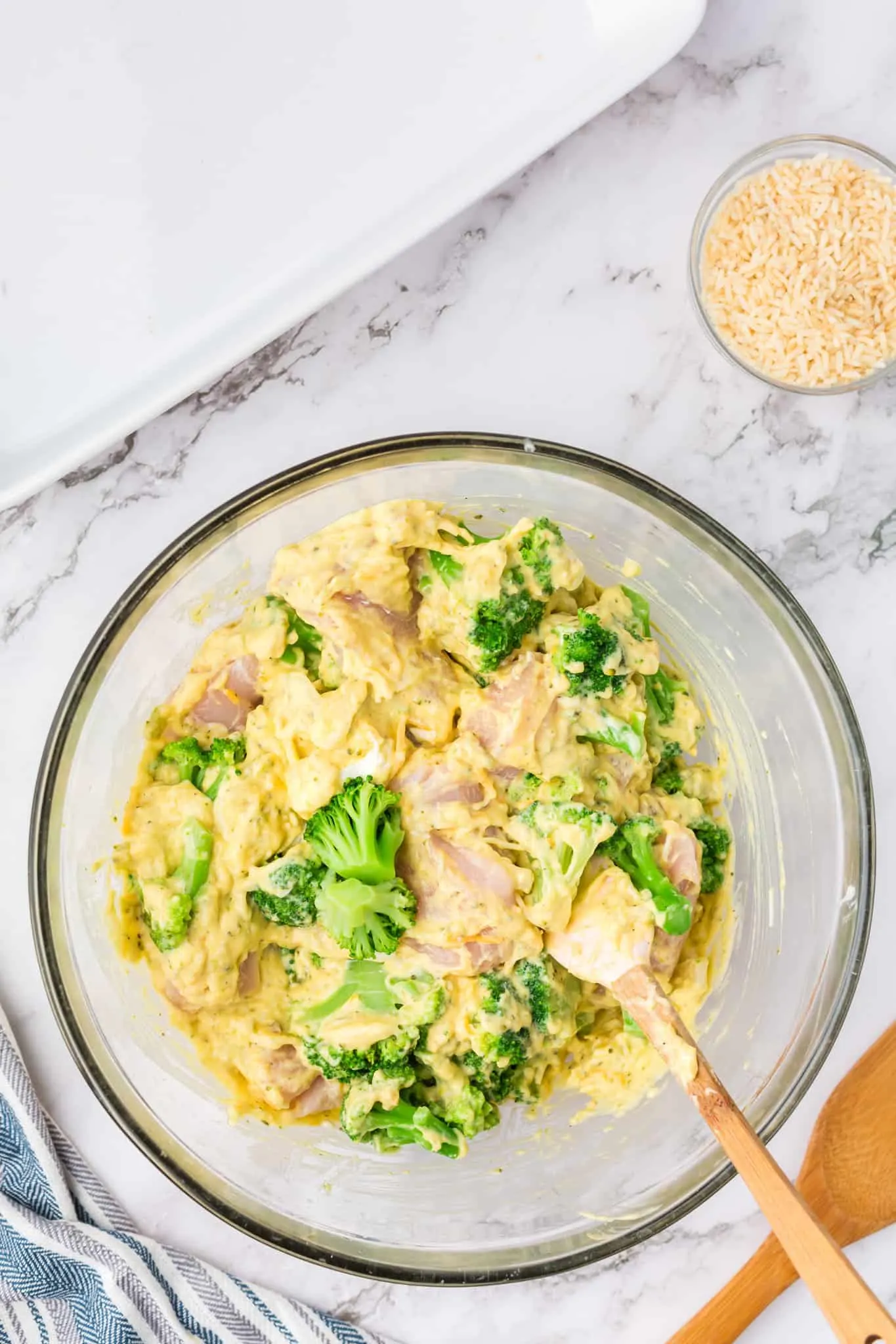 cheesy broccoli soup, chicken and broccoli florets in a bowl