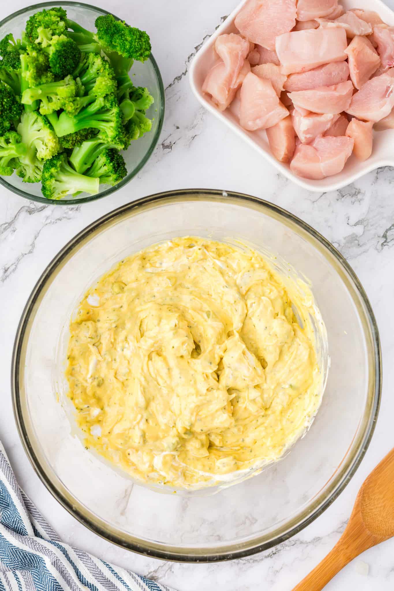 cream cheese, velveeta broccoli soup and sour cream mixture in a mixing bowl