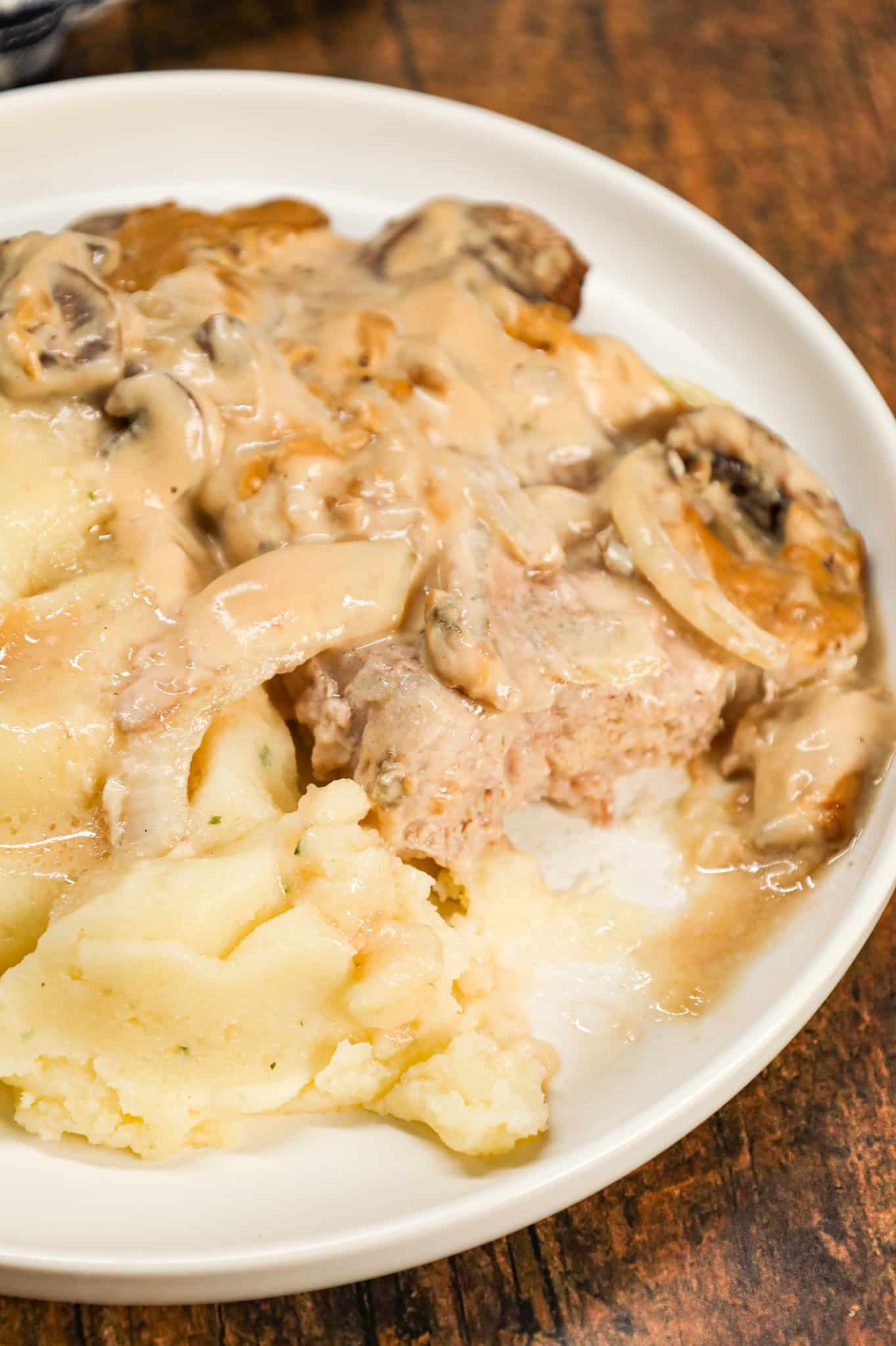 Cream of Mushroom Pork Chops are an easy baked pork chop recipe made with cream of mushroom soup, sour cream, pork gravy mix, sliced onions and sliced mushrooms.