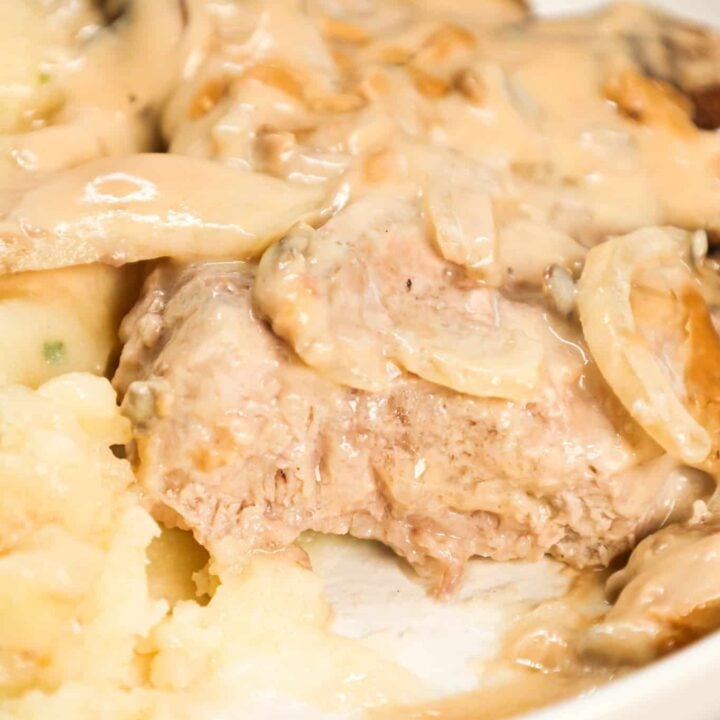 Cream of Mushroom Pork Chops are an easy baked pork chop recipe made with cream of mushroom soup, sour cream, pork gravy mix, sliced onions and sliced mushrooms.