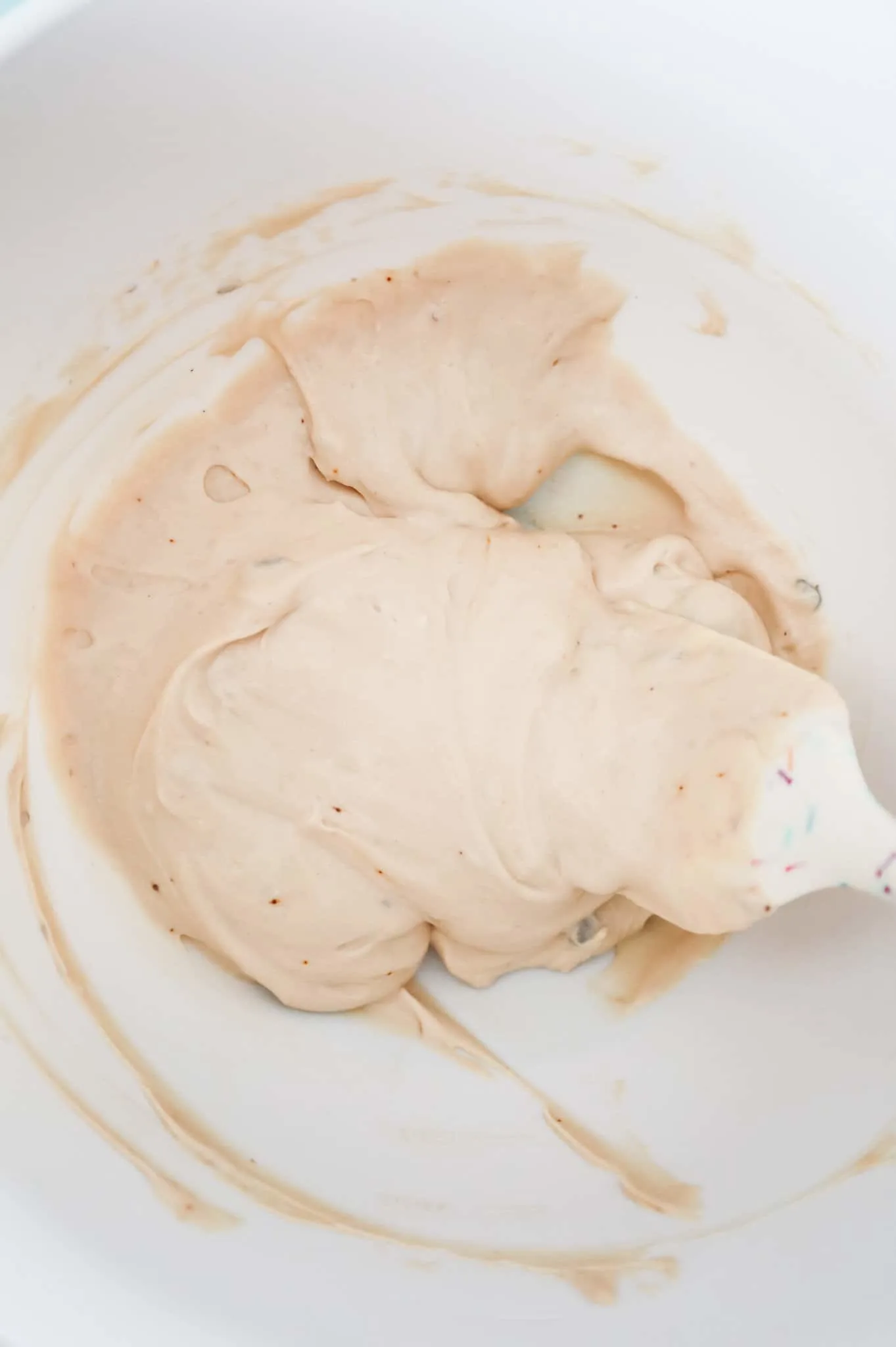 cream of mushroom soup and sour cream mixture in a mixing bowl