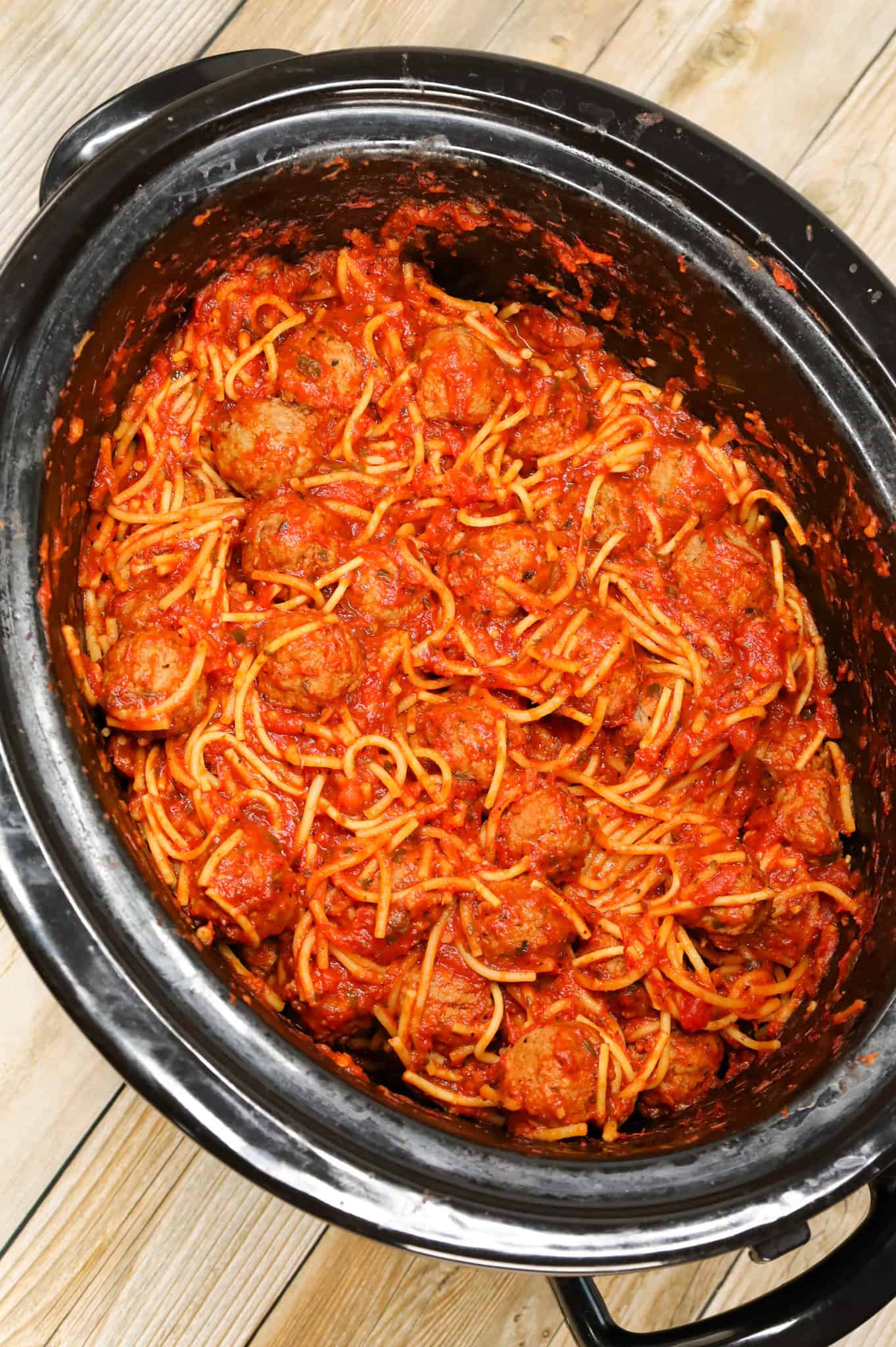 Crock Pot Spaghetti and Meatballs is an easy slow cooker dinner recipe made with frozen meatballs, marinara sauce, spaghetti and spices.