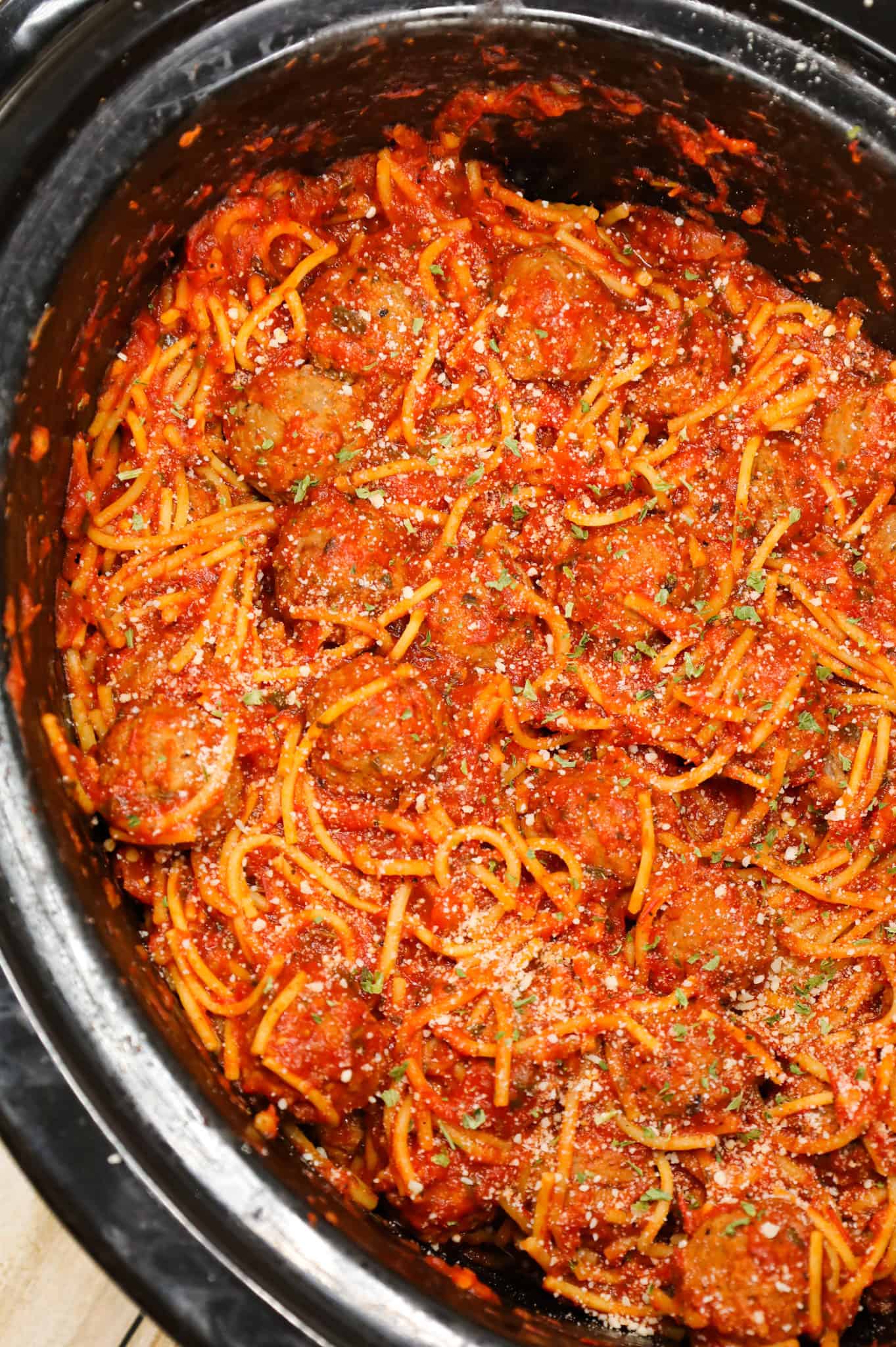 Crock Pot Spaghetti and Meatballs is an easy slow cooker dinner recipe made with frozen meatballs, marinara sauce, spaghetti and spices.