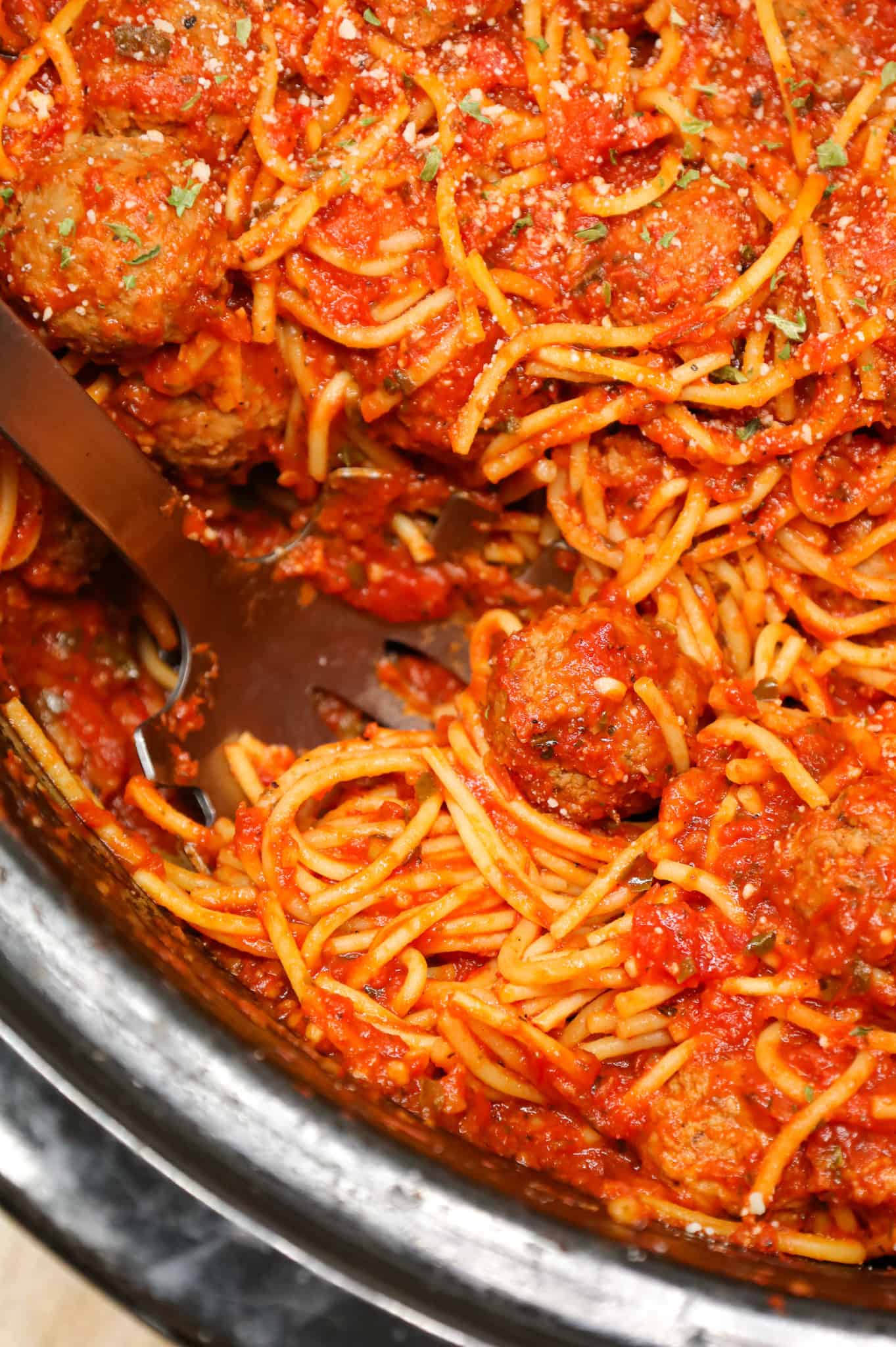 Crock Pot Spaghetti and Meatballs is an easy slow cooker dinner recipe made with frozen meatballs, marinara sauce, spaghetti and spices.