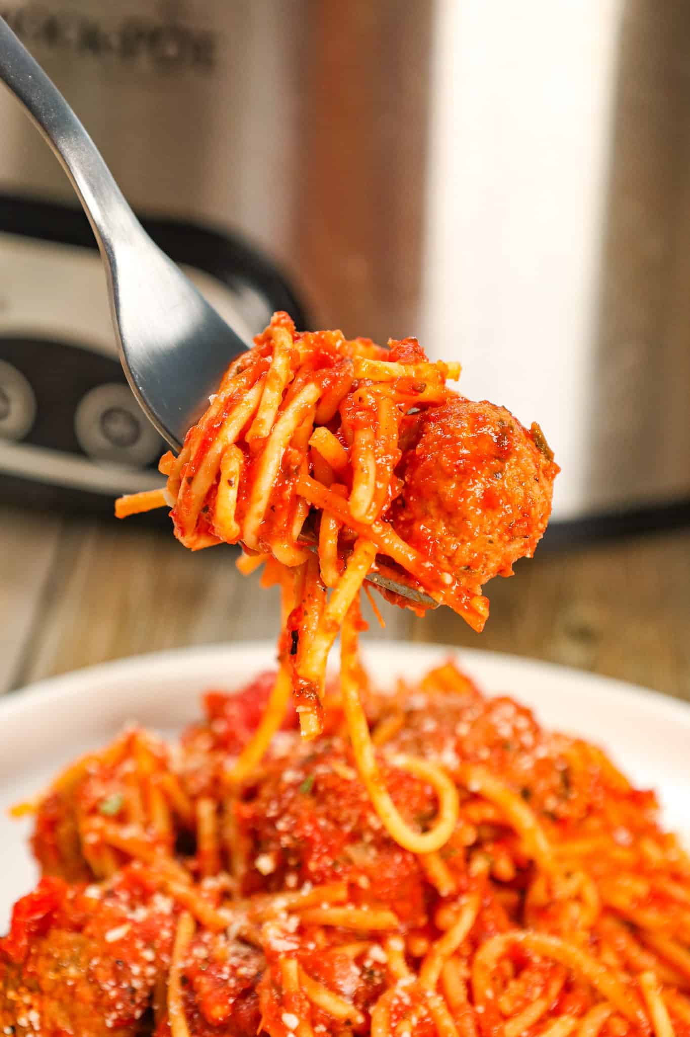 Crock Pot Spaghetti and Meatballs is an easy slow cooker dinner recipe made with frozen meatballs, marinara sauce, spaghetti and spices.