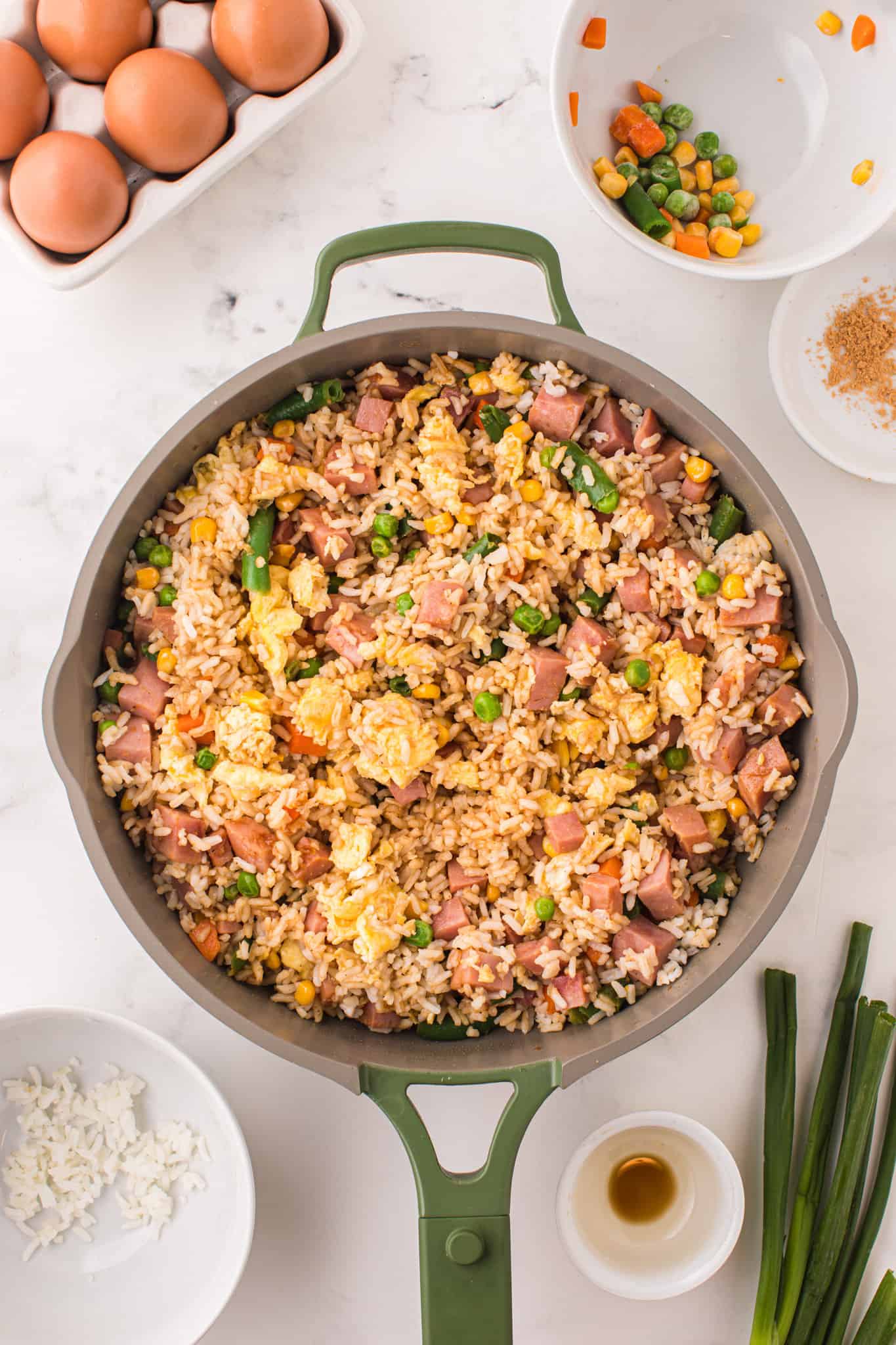 ham fried rice cooking in a skillet