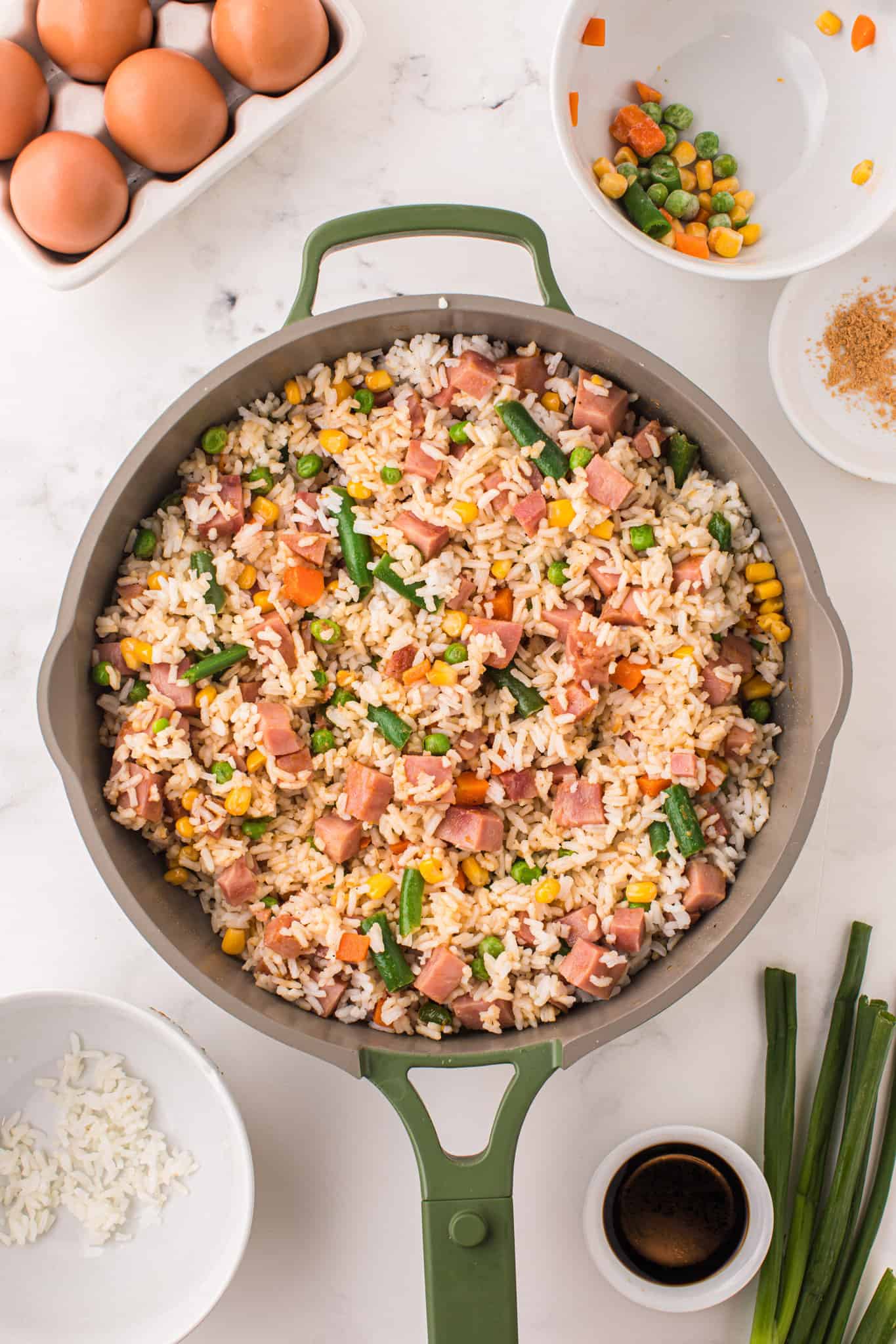 rice, veggie and diced ham mixture in a skillet