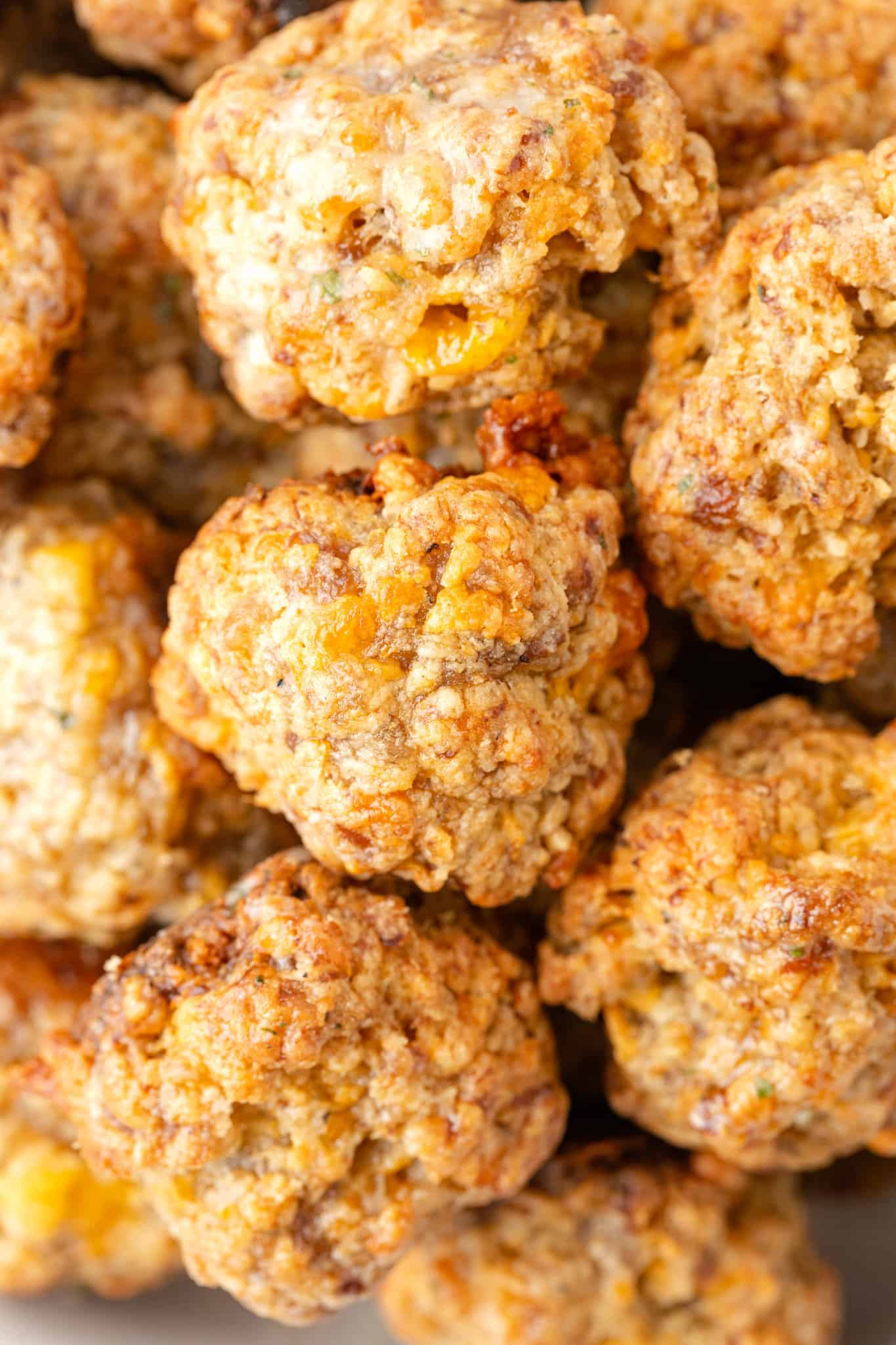 Cheddar Bay Sausage Balls are delicious bite sized balls made with sausage meat, shredded cheddar cheese and Red Lobster Cheddar Bay Biscuit mix.