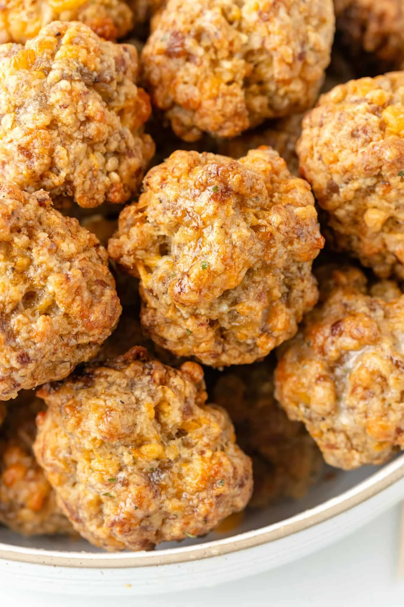 Cheddar Bay Sausage Balls are delicious bite sized balls made with sausage meat, shredded cheddar cheese and Red Lobster Cheddar Bay Biscuit mix.