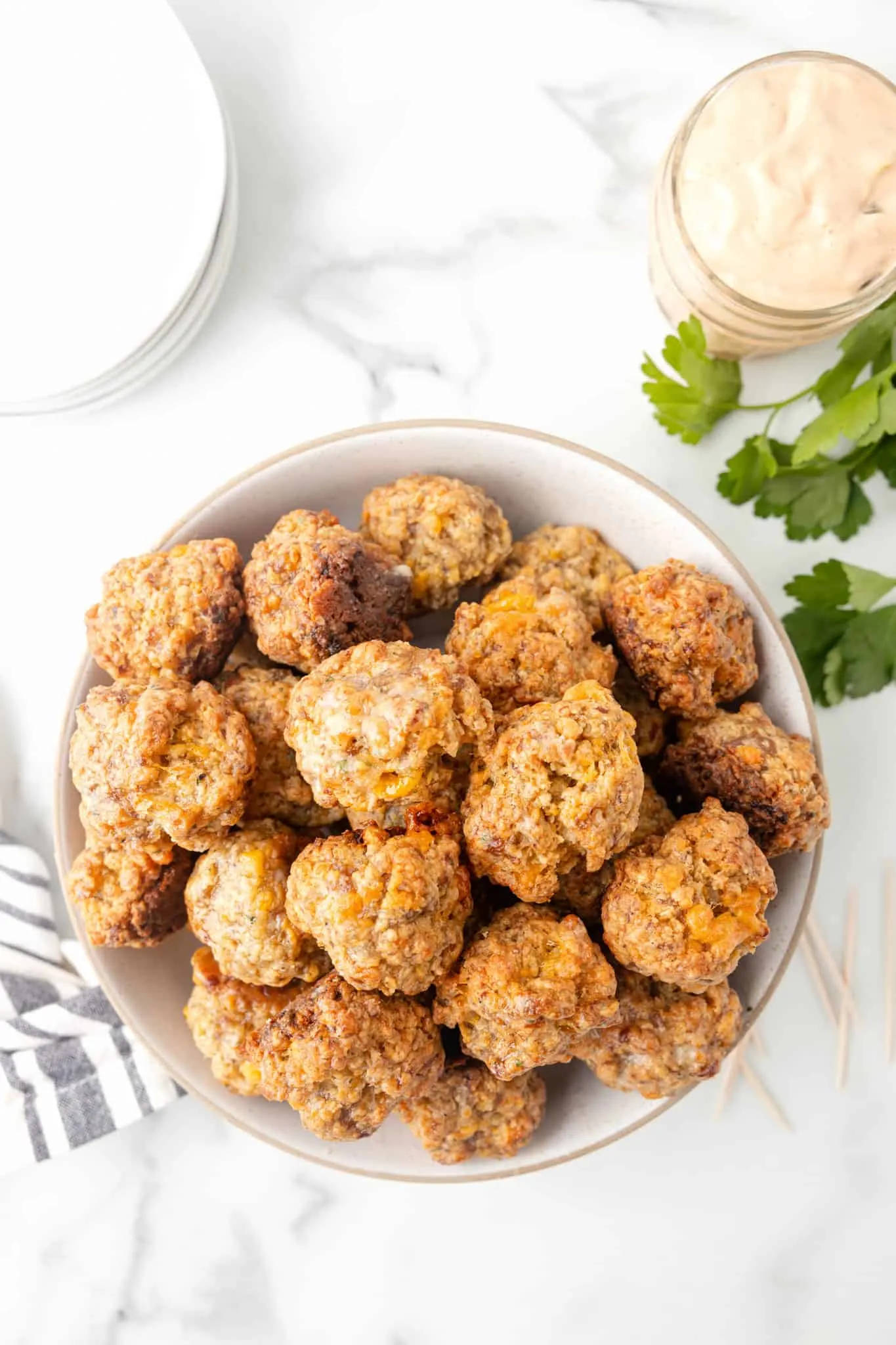 Cheddar Bay Sausage Balls are delicious bite sized balls made with sausage meat, shredded cheddar cheese and Red Lobster Cheddar Bay Biscuit mix.