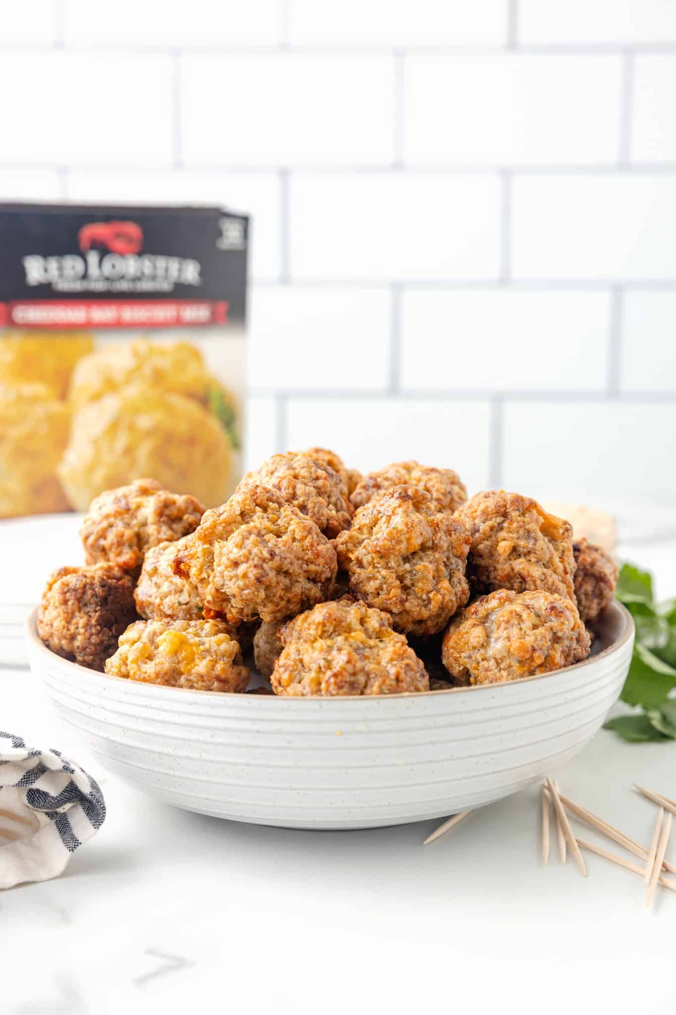 Cheddar Bay Sausage Balls are delicious bite sized balls made with sausage meat, shredded cheddar cheese and Red Lobster Cheddar Bay Biscuit mix.