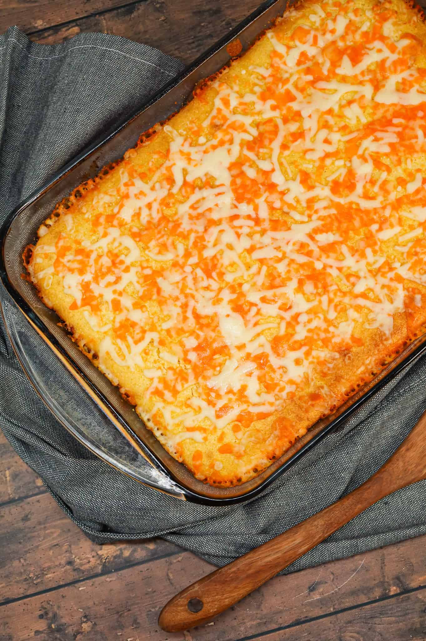 Sloppy Joe Cornbread Casserole is a hearty hamburger casserole with a base of crumbled ground beef in sloppy joe sauce topped with a layer of Jiffy cornbread.