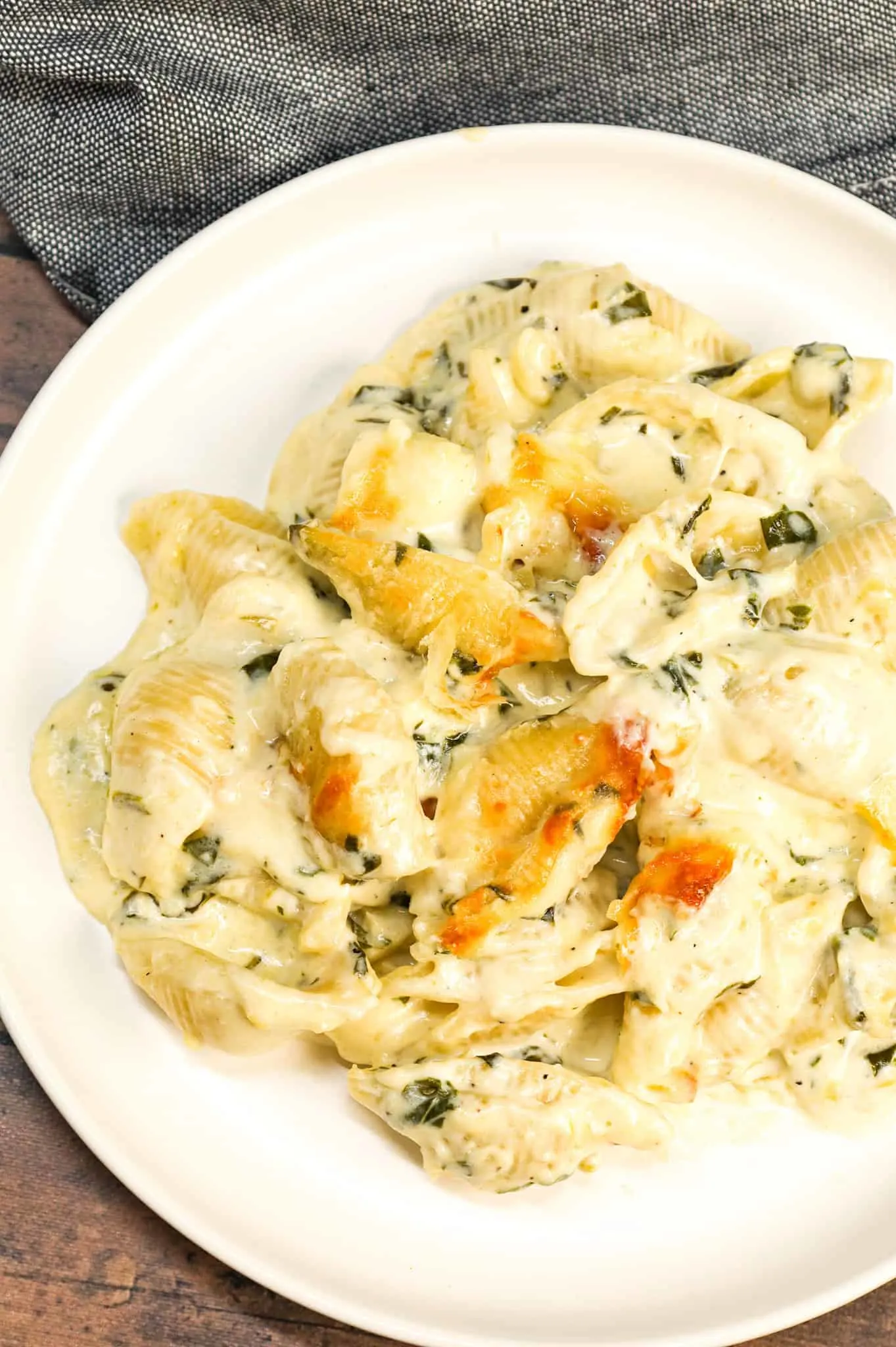 Spinach Artichoke Pasta Bake is a creamy baked pasta recipe loaded with cream cheese, chopped artichoke hearts, chopped spinach, parmesan and mozzarella.