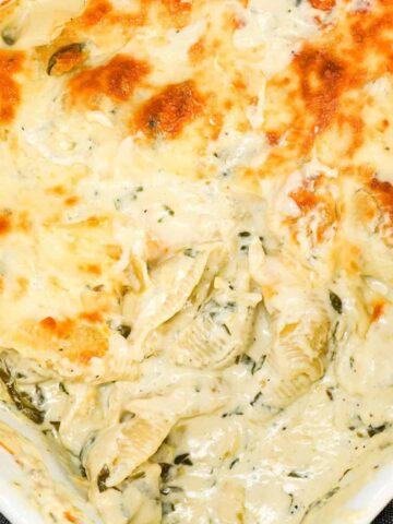 Spinach Artichoke Pasta Bake is a creamy baked pasta recipe loaded with cream cheese, chopped artichoke hearts, chopped spinach, parmesan and mozzarella.