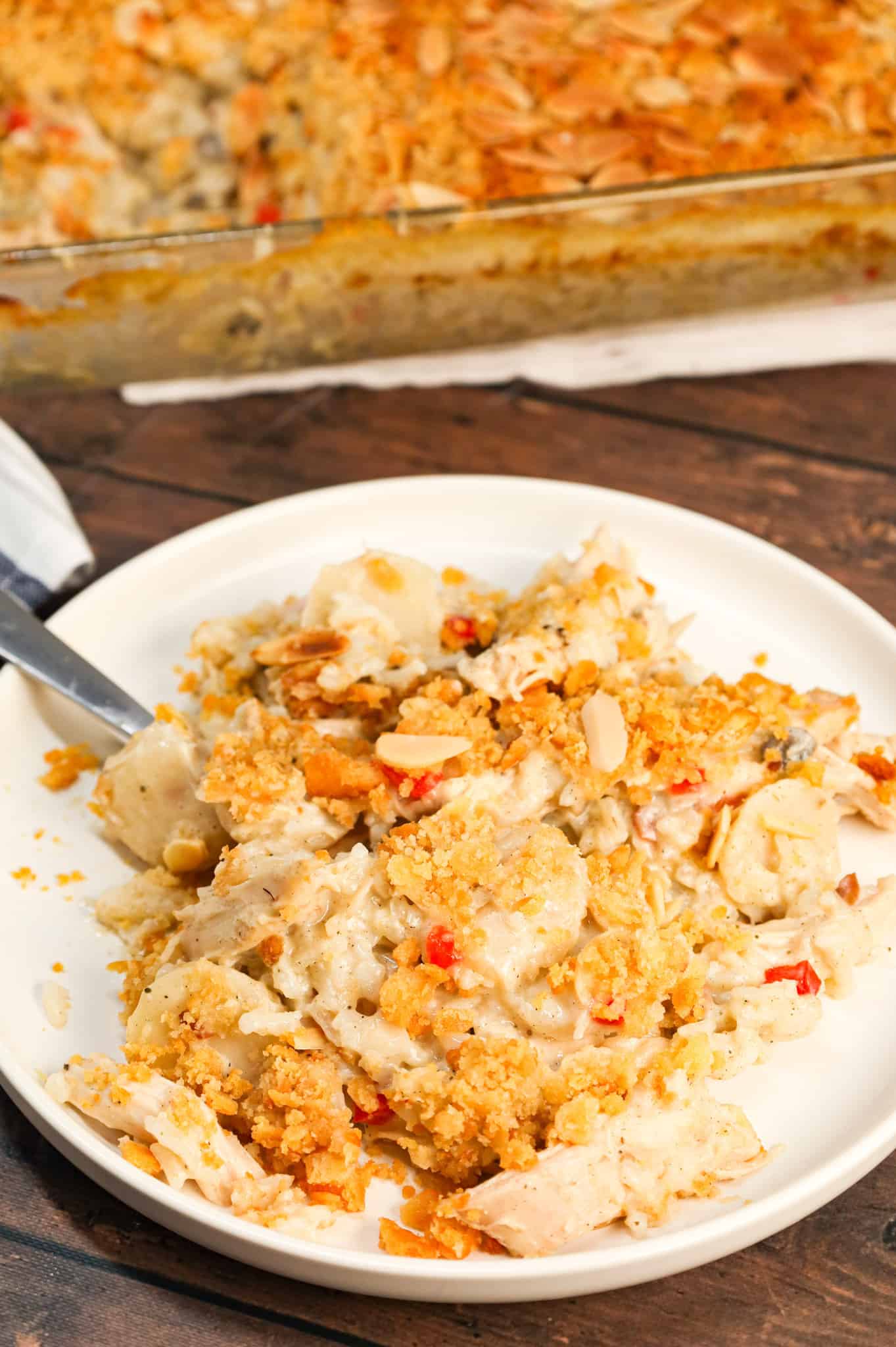 Water Chestnut Chicken and Rice Casserole is a hearty chicken casserole loaded with shredded rotisserie chicken, water chestnuts, almonds, pimentos and instant rice all topped with a buttery Ritz cracker crumb topping.