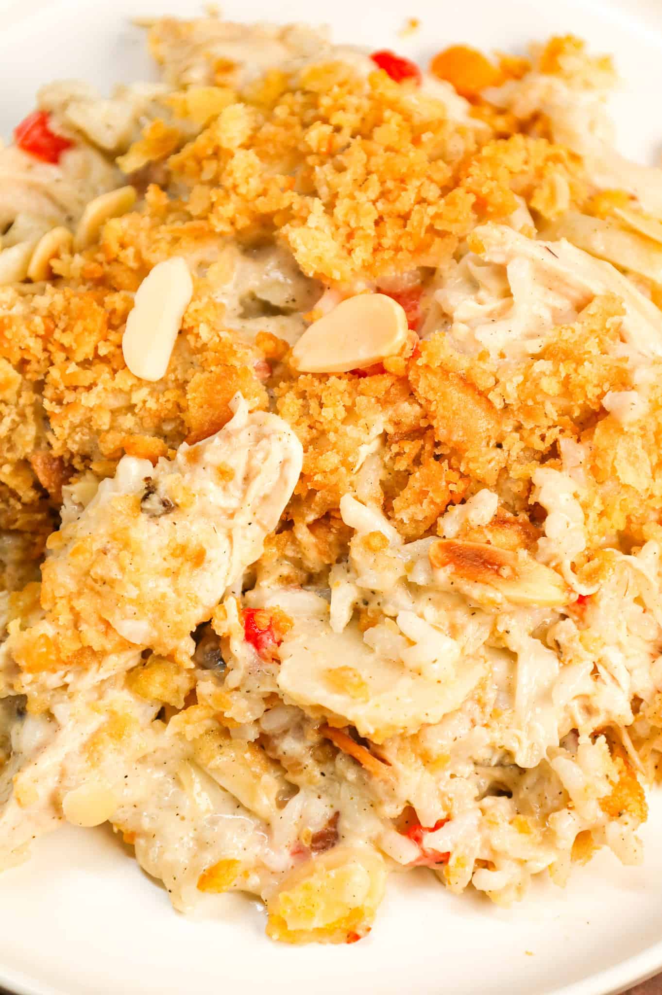 Water Chestnut Chicken and Rice Casserole is a hearty chicken casserole loaded with shredded rotisserie chicken, water chestnuts, almonds, pimentos and instant rice all topped with a buttery Ritz cracker crumb topping.