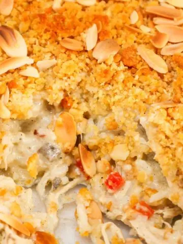 Water Chestnut Chicken and Rice Casserole is a hearty chicken casserole loaded with shredded rotisserie chicken, water chestnuts, almonds, pimentos and instant rice all topped with a buttery Ritz cracker crumb topping.