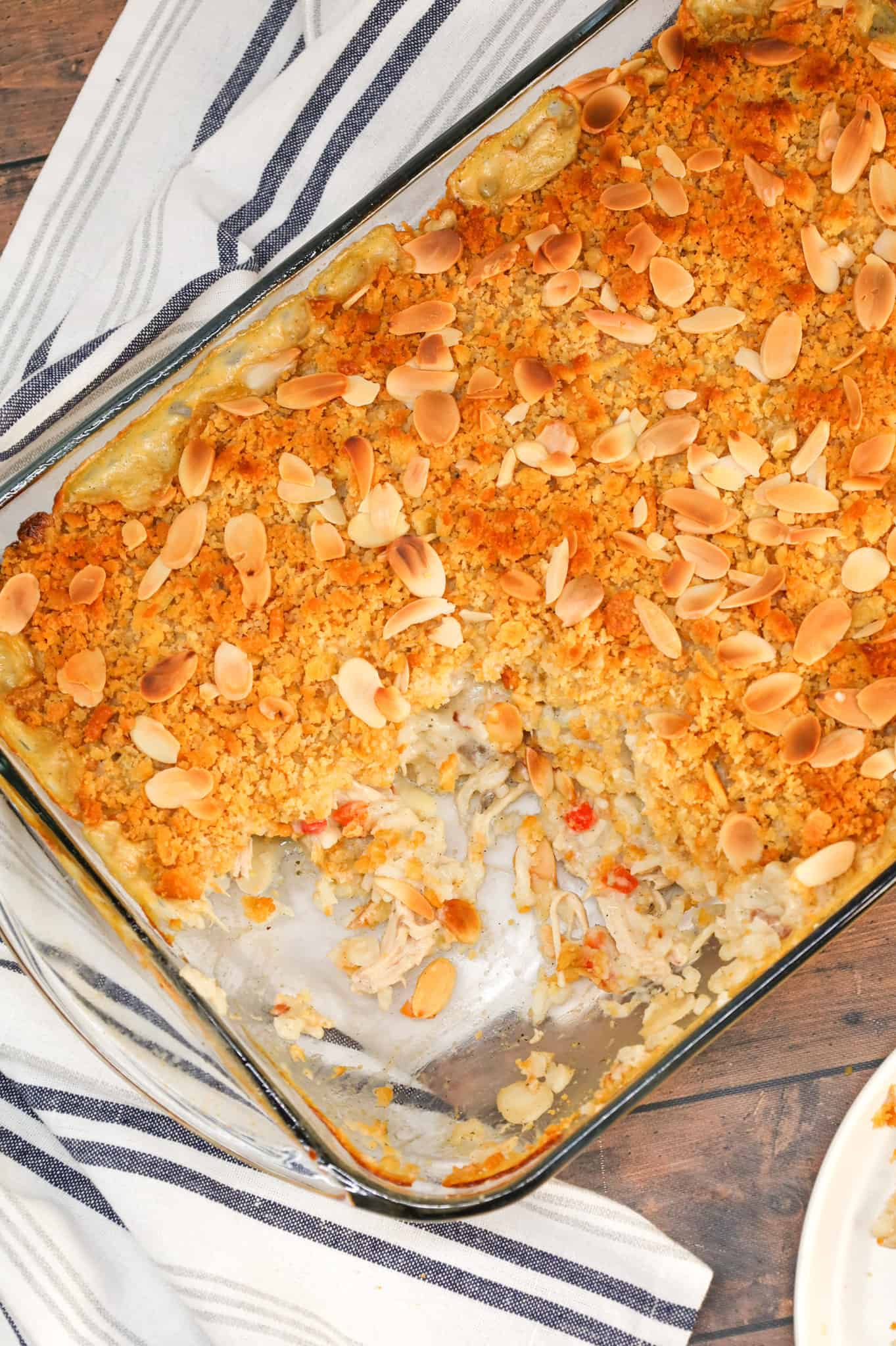 Water Chestnut Chicken and Rice Casserole is a hearty chicken casserole loaded with shredded rotisserie chicken, water chestnuts, almonds, pimentos and instant rice all topped with a buttery Ritz cracker crumb topping.