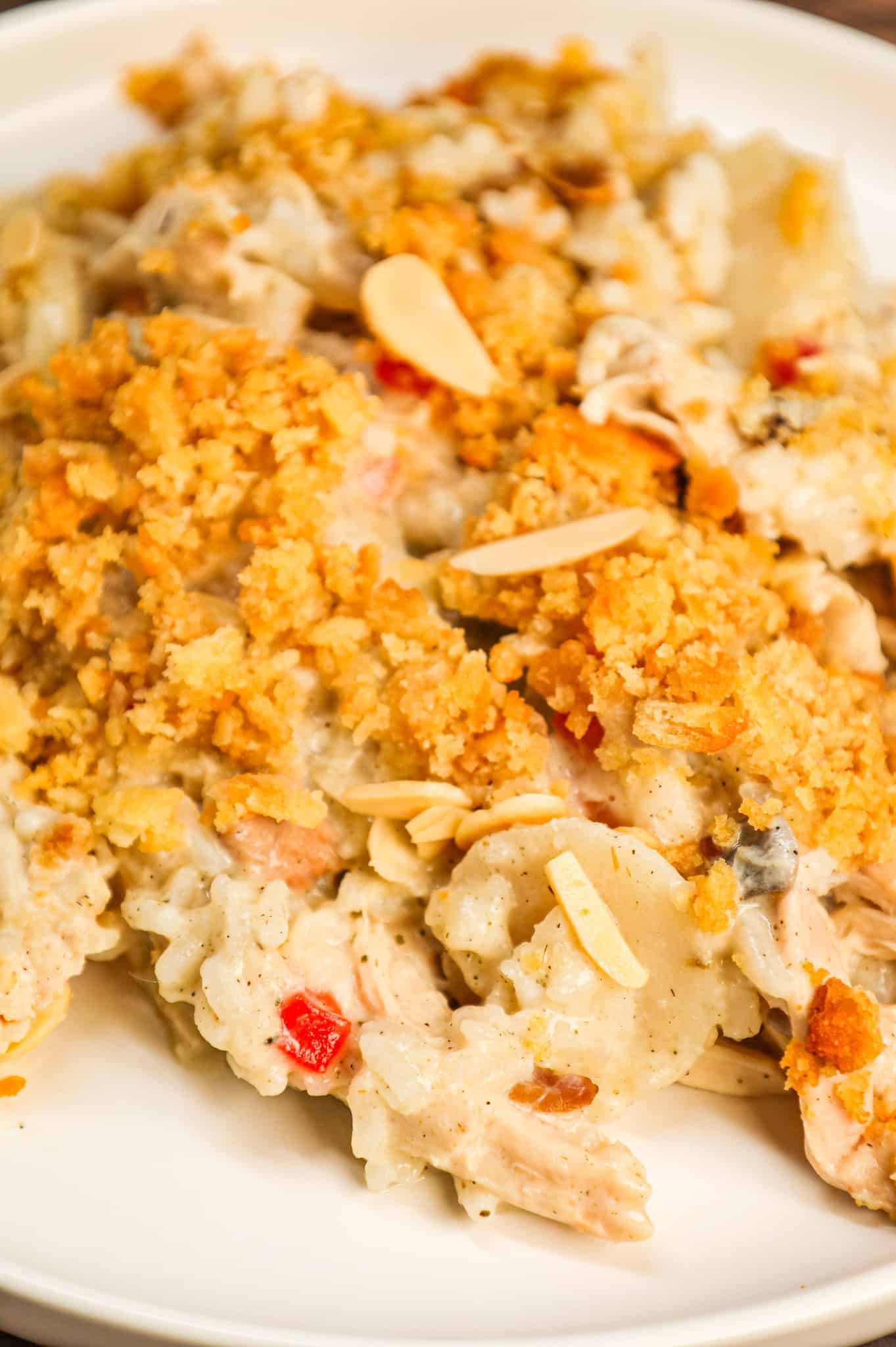 Water Chestnut Chicken and Rice Casserole is a hearty chicken casserole loaded with shredded rotisserie chicken, water chestnuts, almonds, pimentos and instant rice all topped with a buttery Ritz cracker crumb topping.