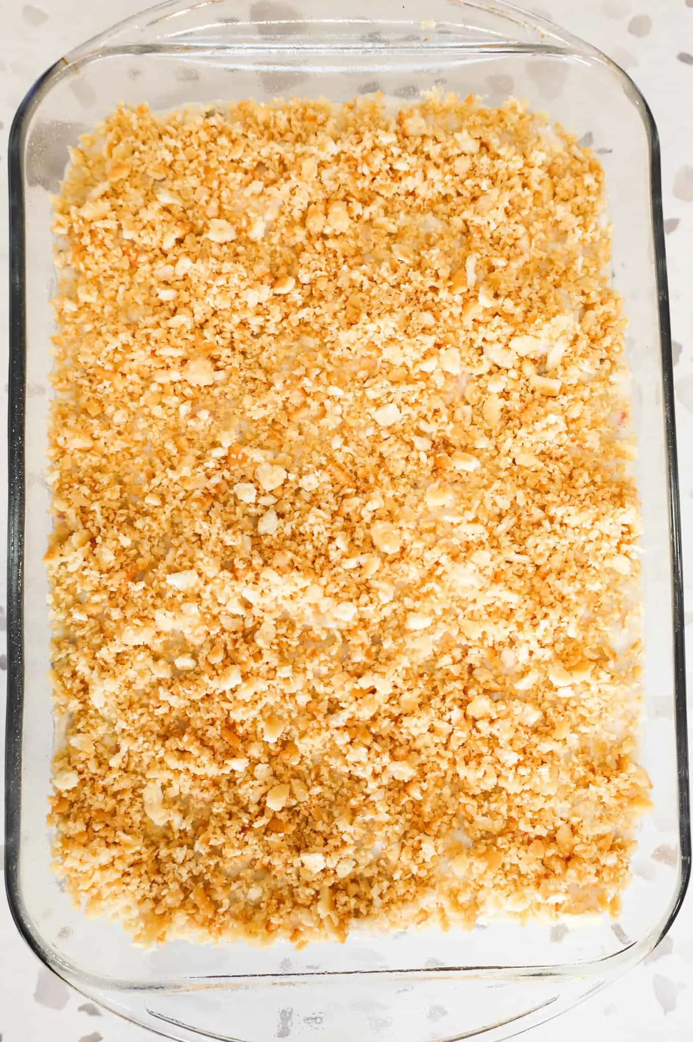 Ritz cracker crumbs sprinkled on top of chicken and rice casserole