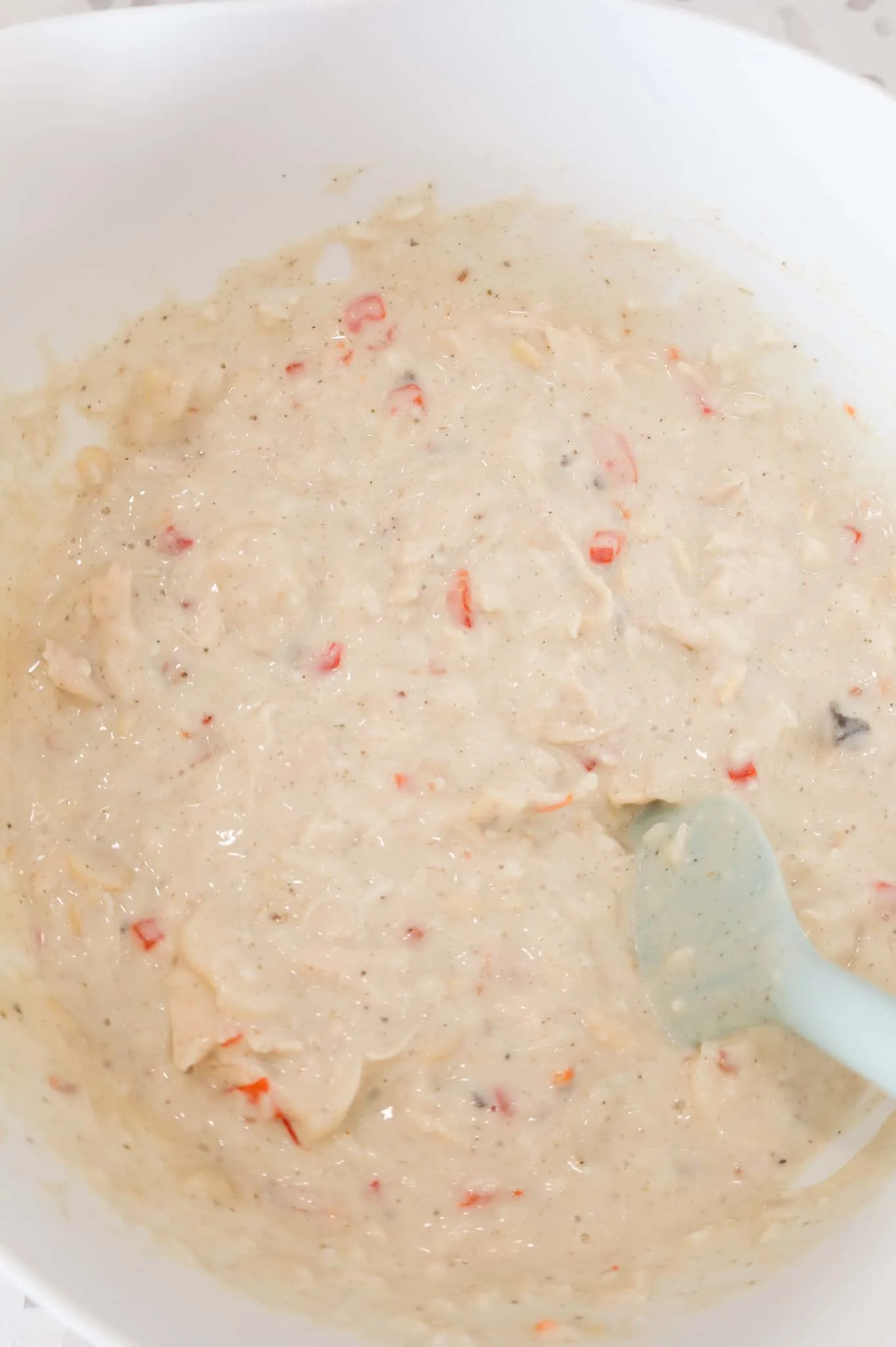 cream soup, rice and chicken mixture in a mixing bowl