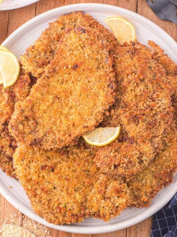 Beef Milanesa is a fried steak recipe using thinly sliced beef, breaded and fried until golden brown and crispy.