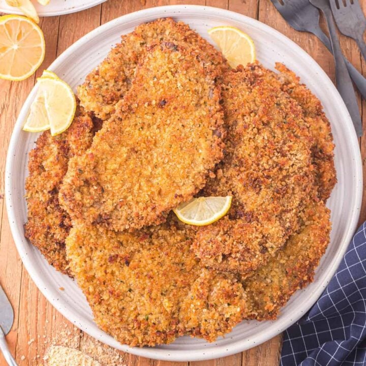 Beef Milanesa is a fried steak recipe using thinly sliced beef, breaded and fried until golden brown and crispy.