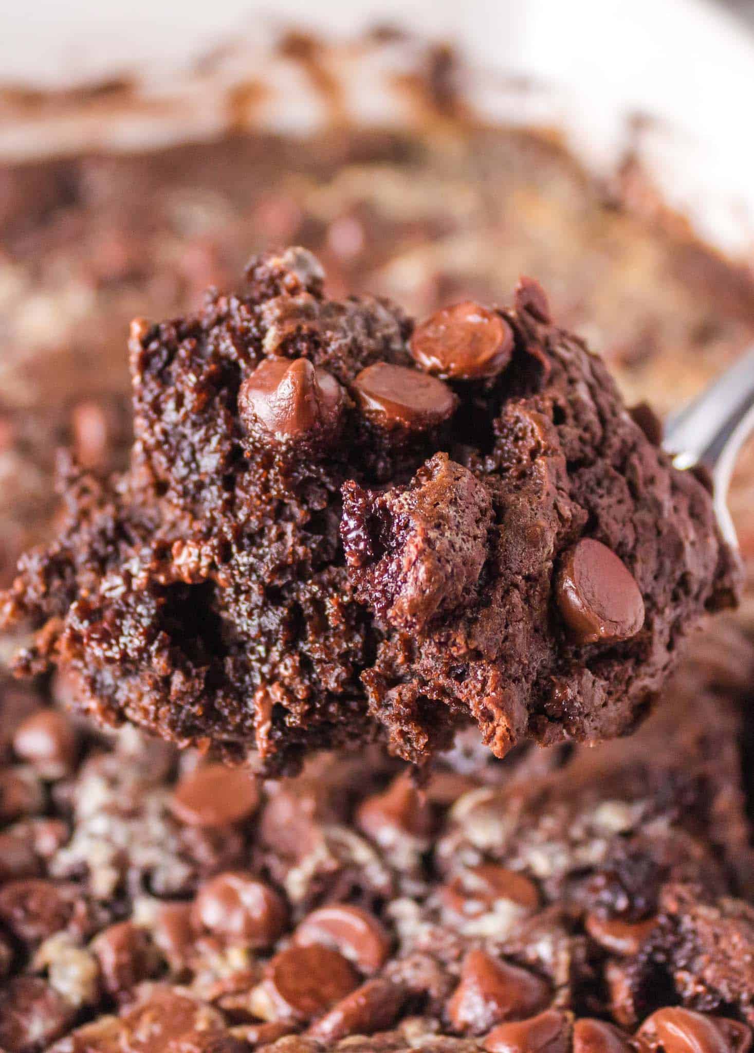 Chocolate Dump Cake is a simple and decadent chocolate dessert recipe using chocolate cake mix, chocolate pudding mix, chocolate chips, milk and butter.