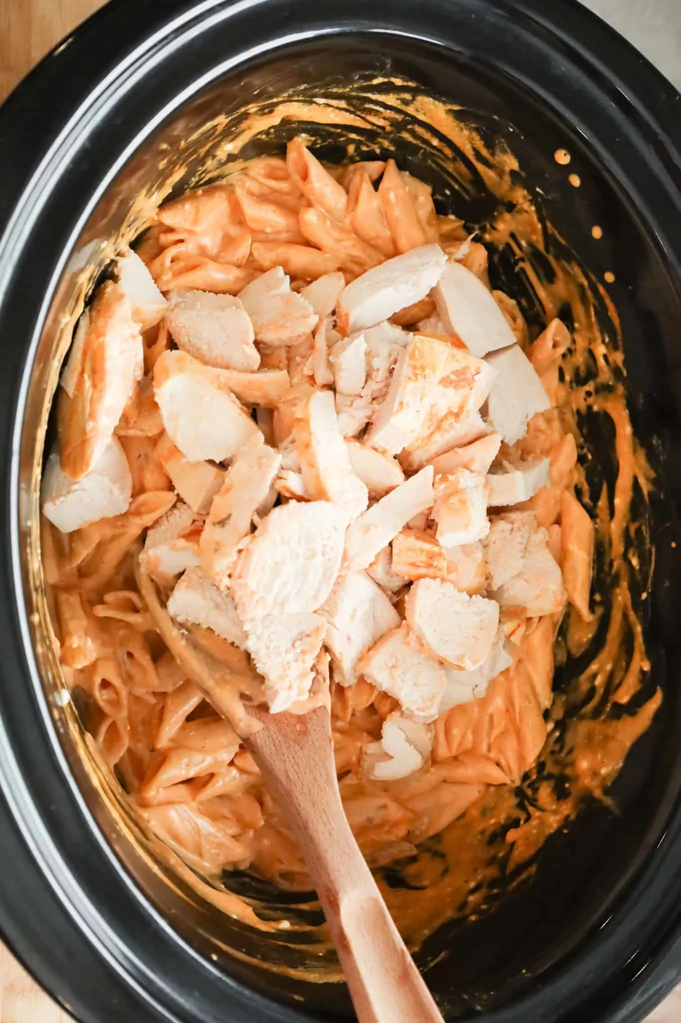 chopped chicken breast added to Crock pot with Buffalo pasta