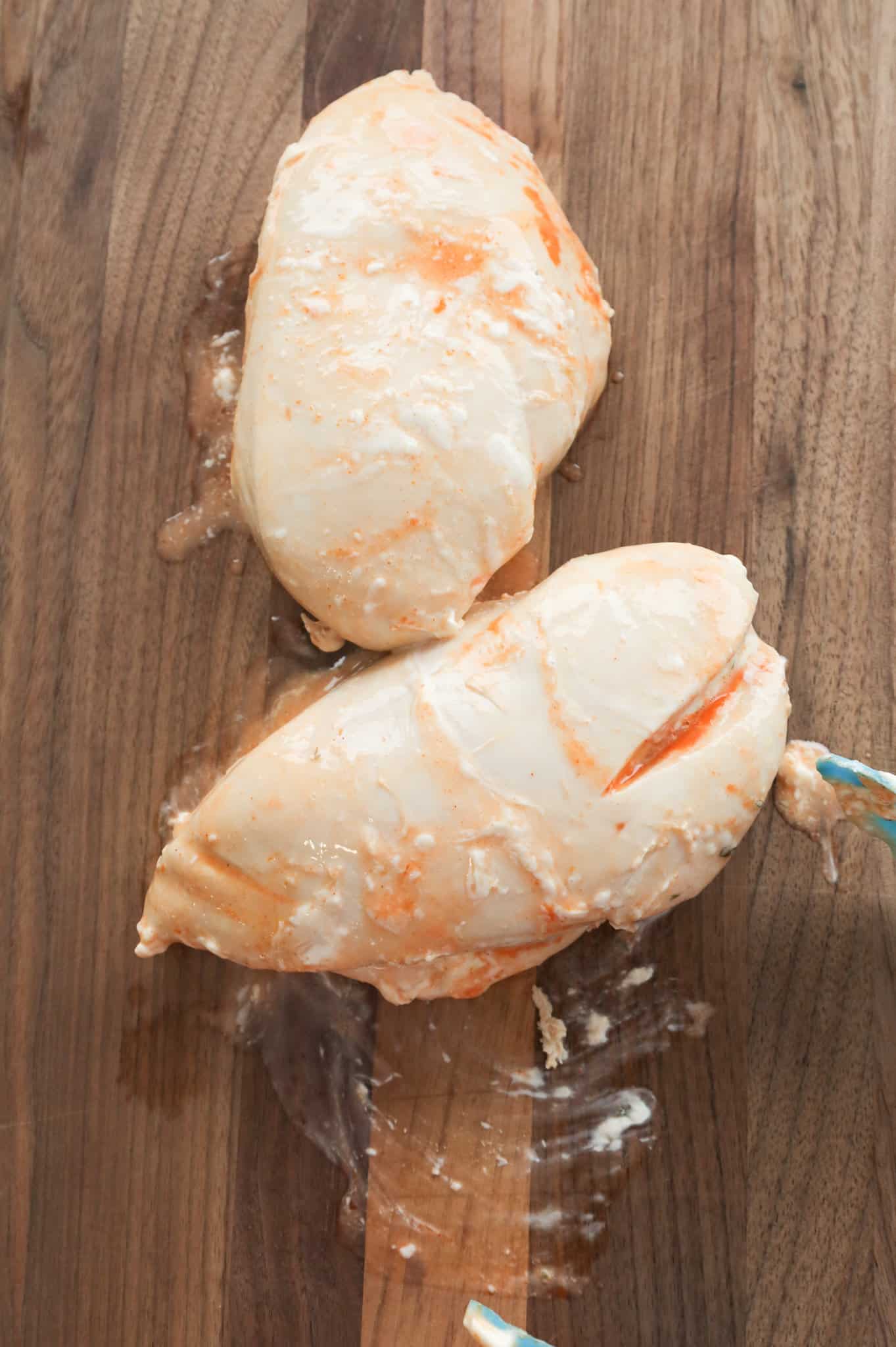 chicken breasts on a cutting board