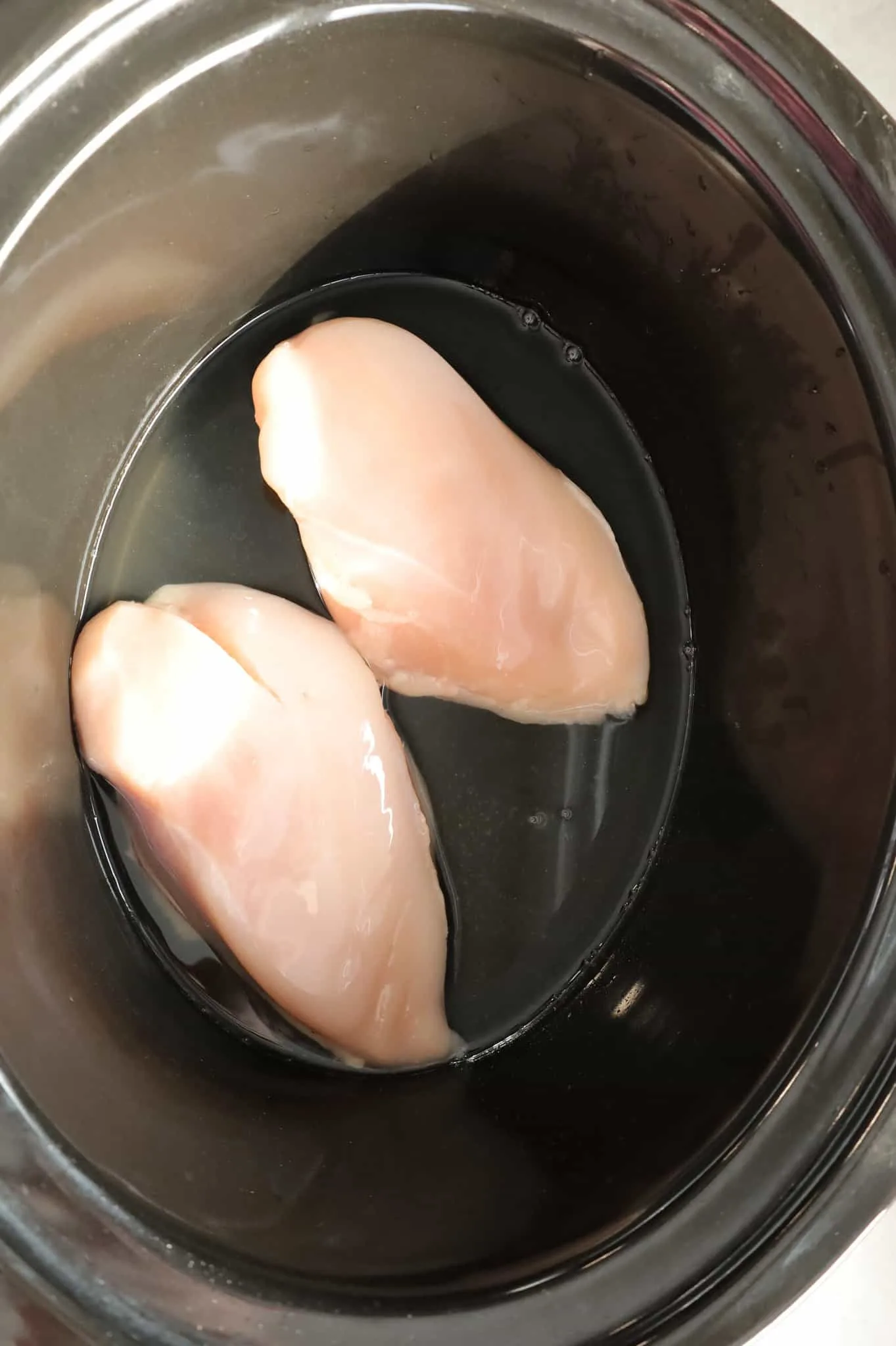 raw chicken breasts in a Crock Pot