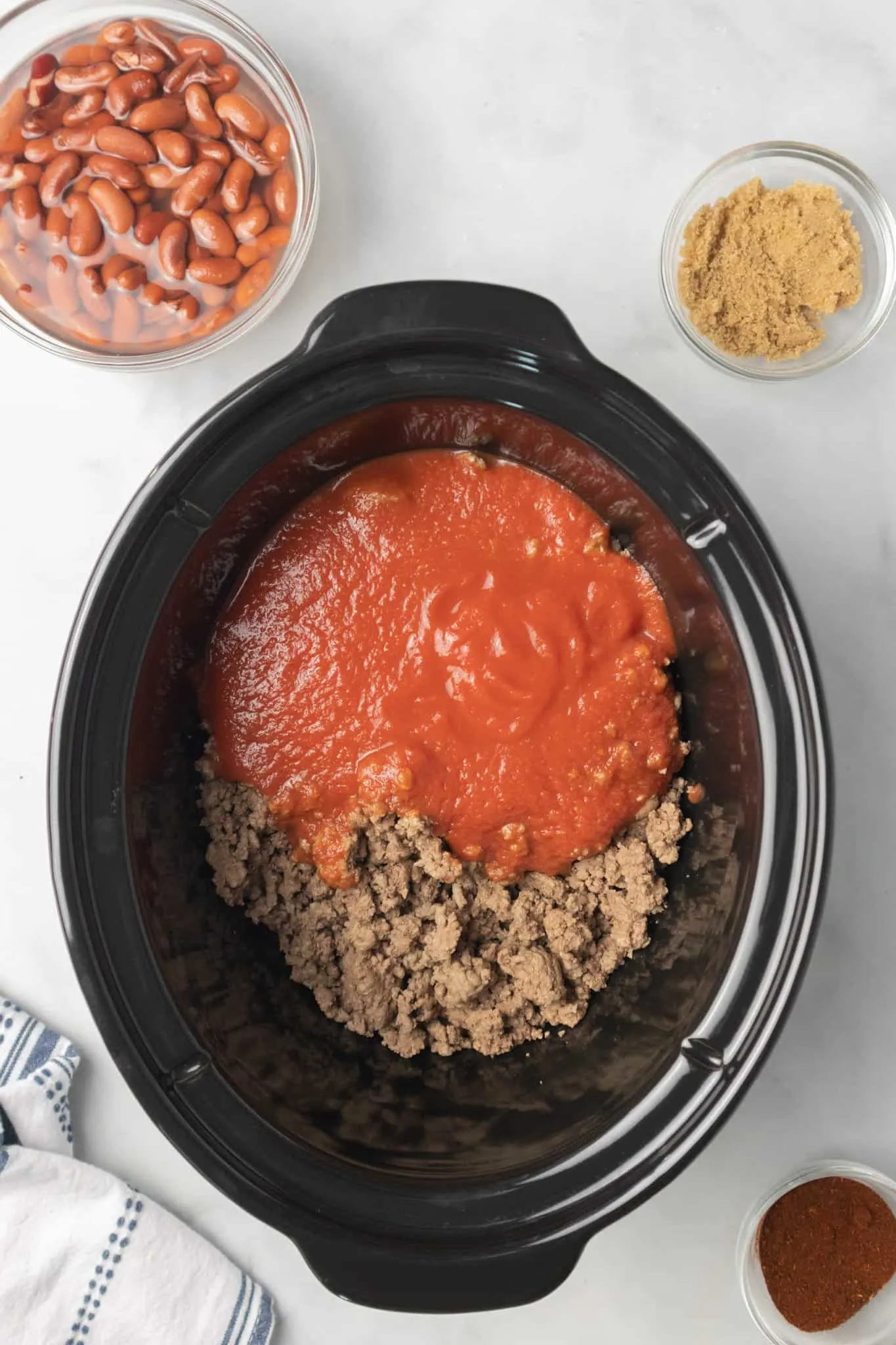 ground beef and tomato sauce in a crock pot