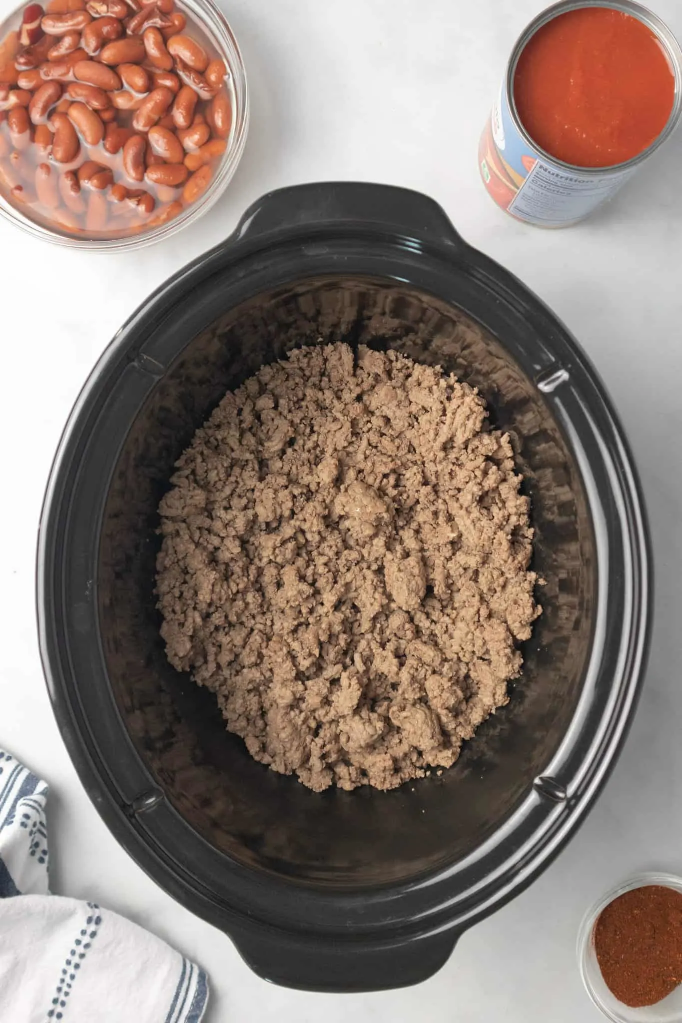 browned ground beef in a Crock Pot