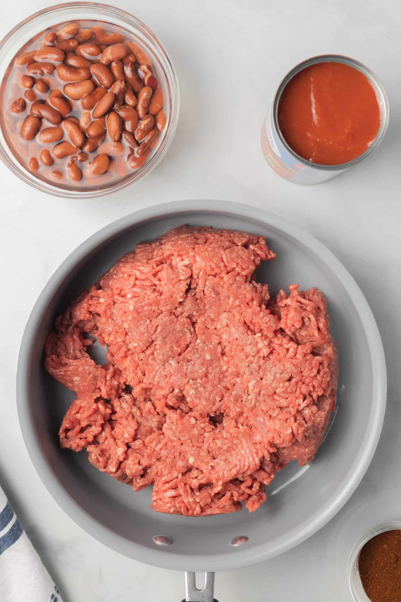 raw ground beef in a skillet