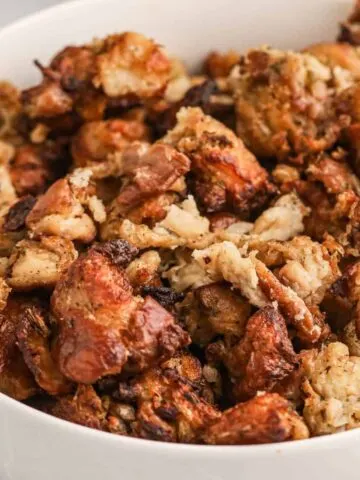 Crock Pot Stuffing is the perfect slow cooker holiday side dish made with packaged stuffing bread cubes, chicken broth, butter, celery, onions and spices.