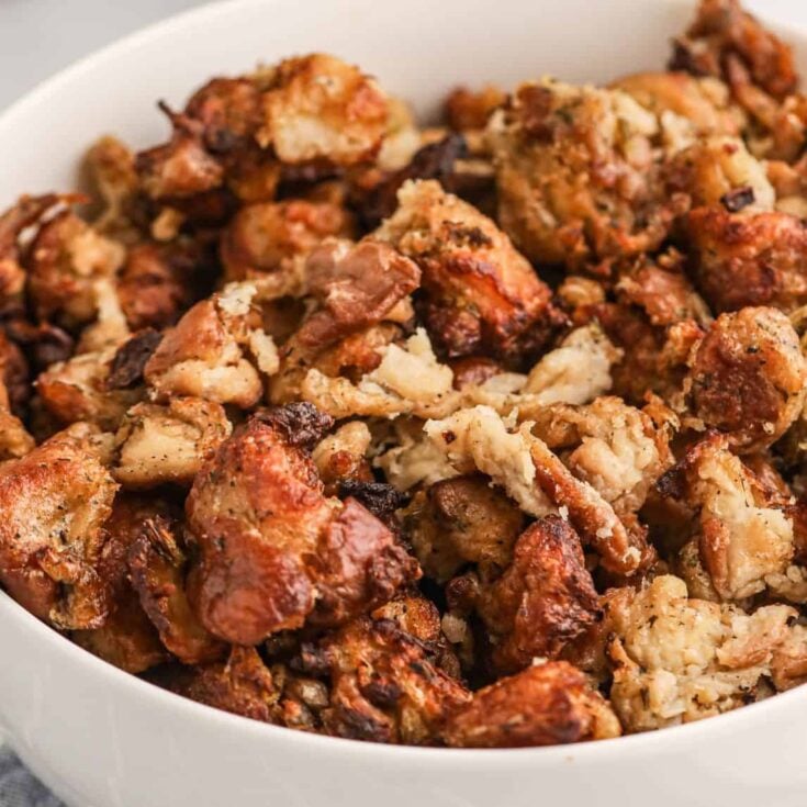 Crock Pot Stuffing is the perfect slow cooker holiday side dish made with packaged stuffing bread cubes, chicken broth, butter, celery, onions and spices.